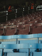 A row of blue seats in a stadium