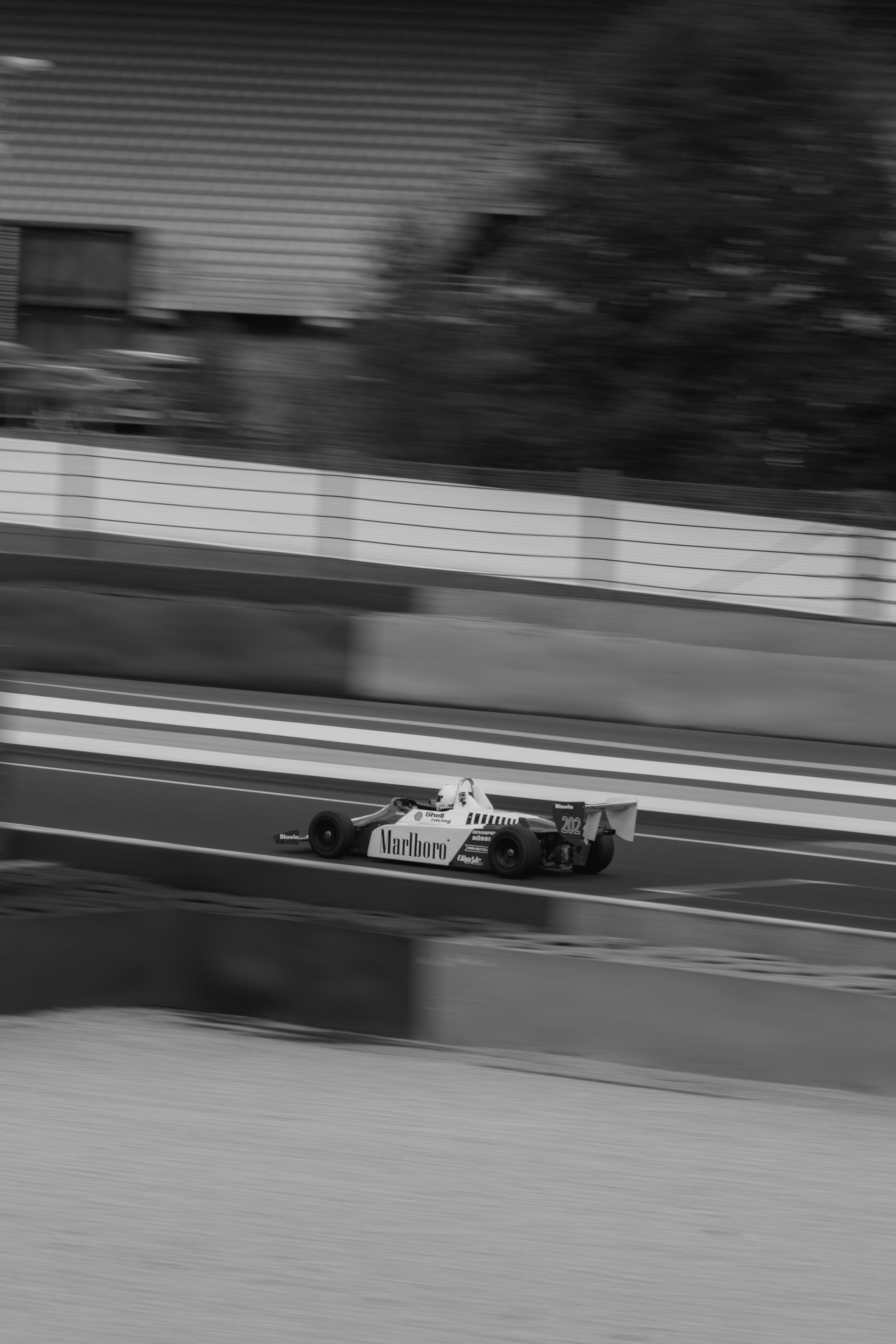 A man riding a motorcycle down a race track