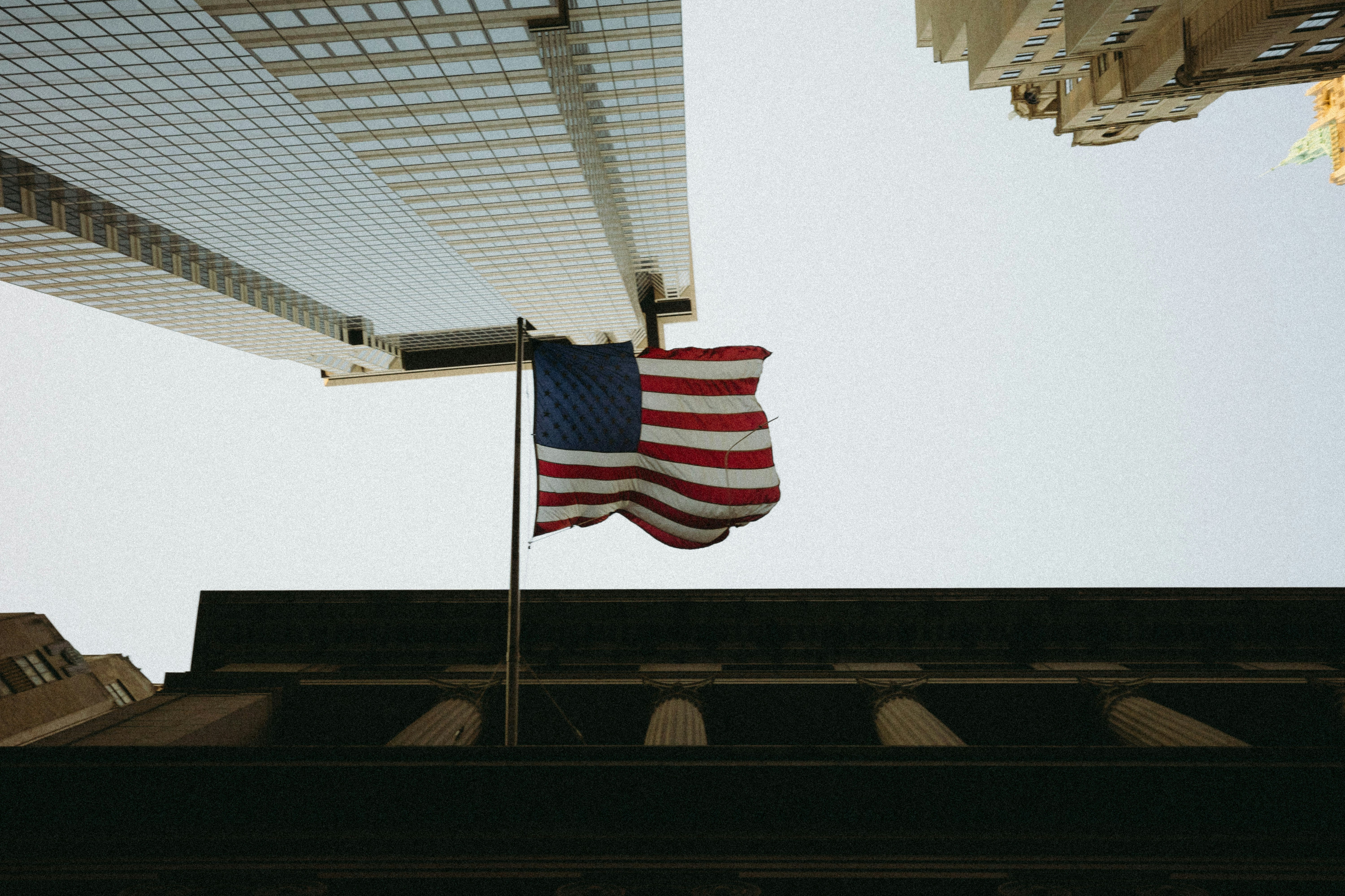 An american flag flying in front of a building