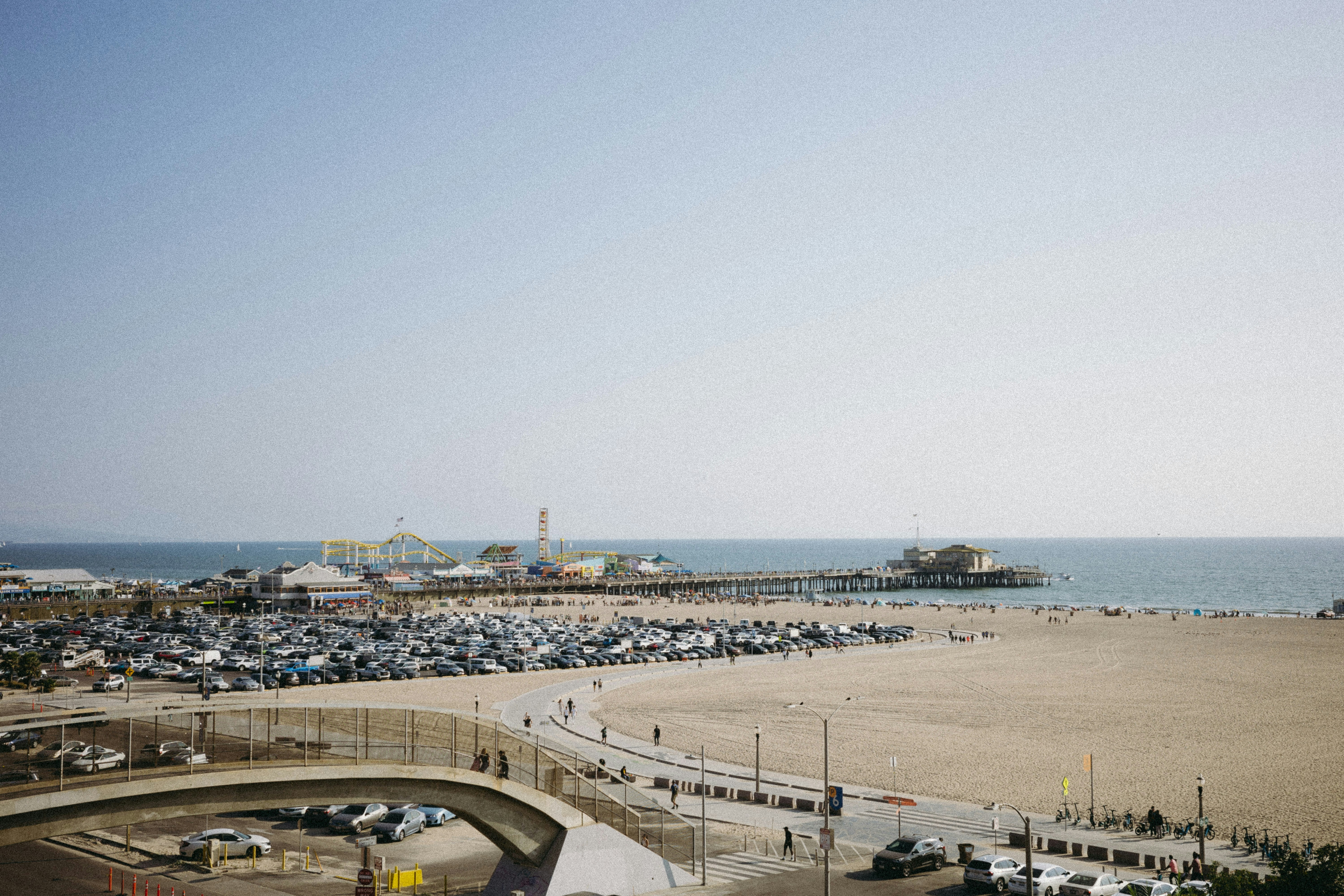 A beach with a lot of cars parked on it