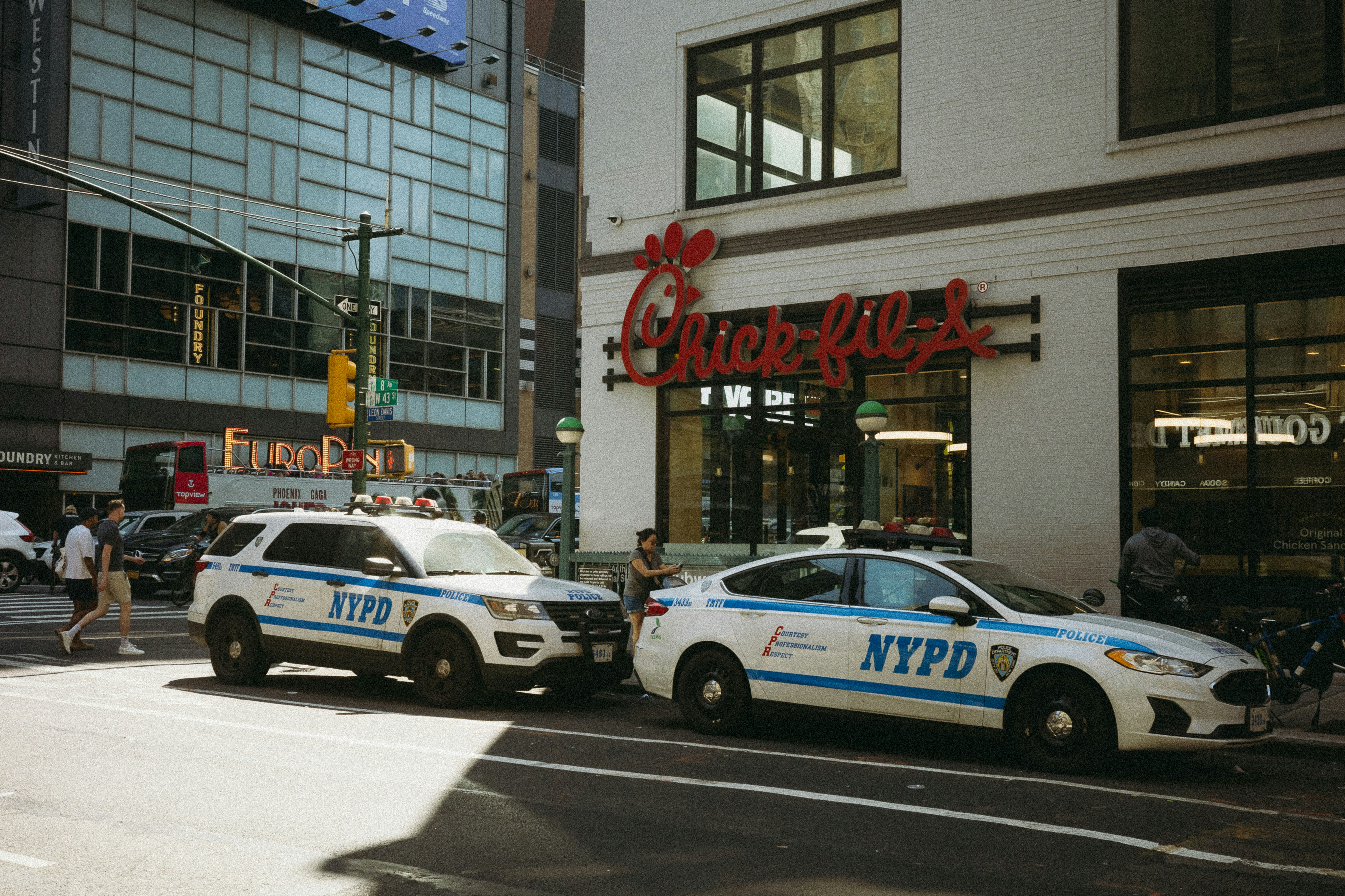 A couple of police cars parked in front of a building