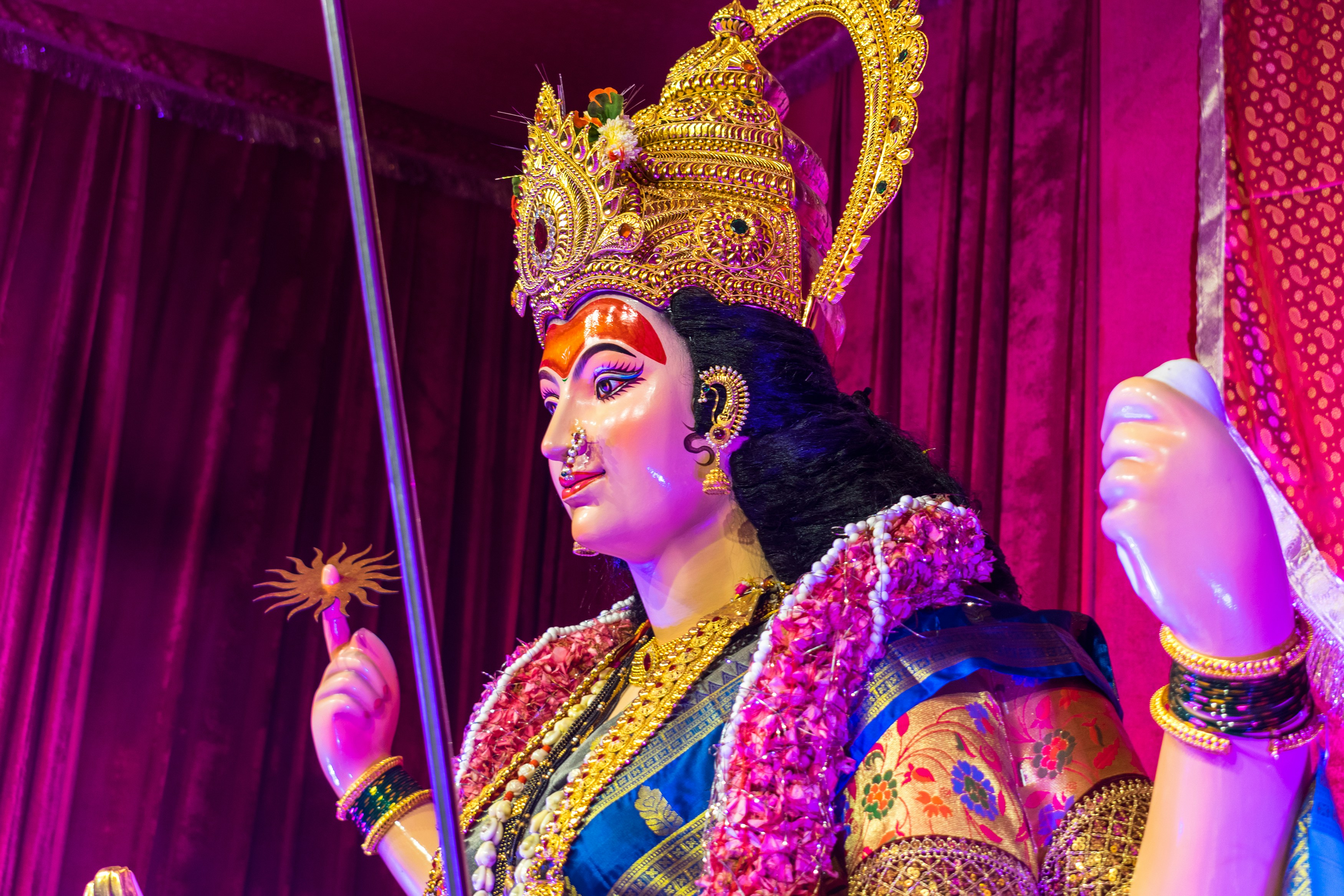 A woman dressed in a costume holding a sword