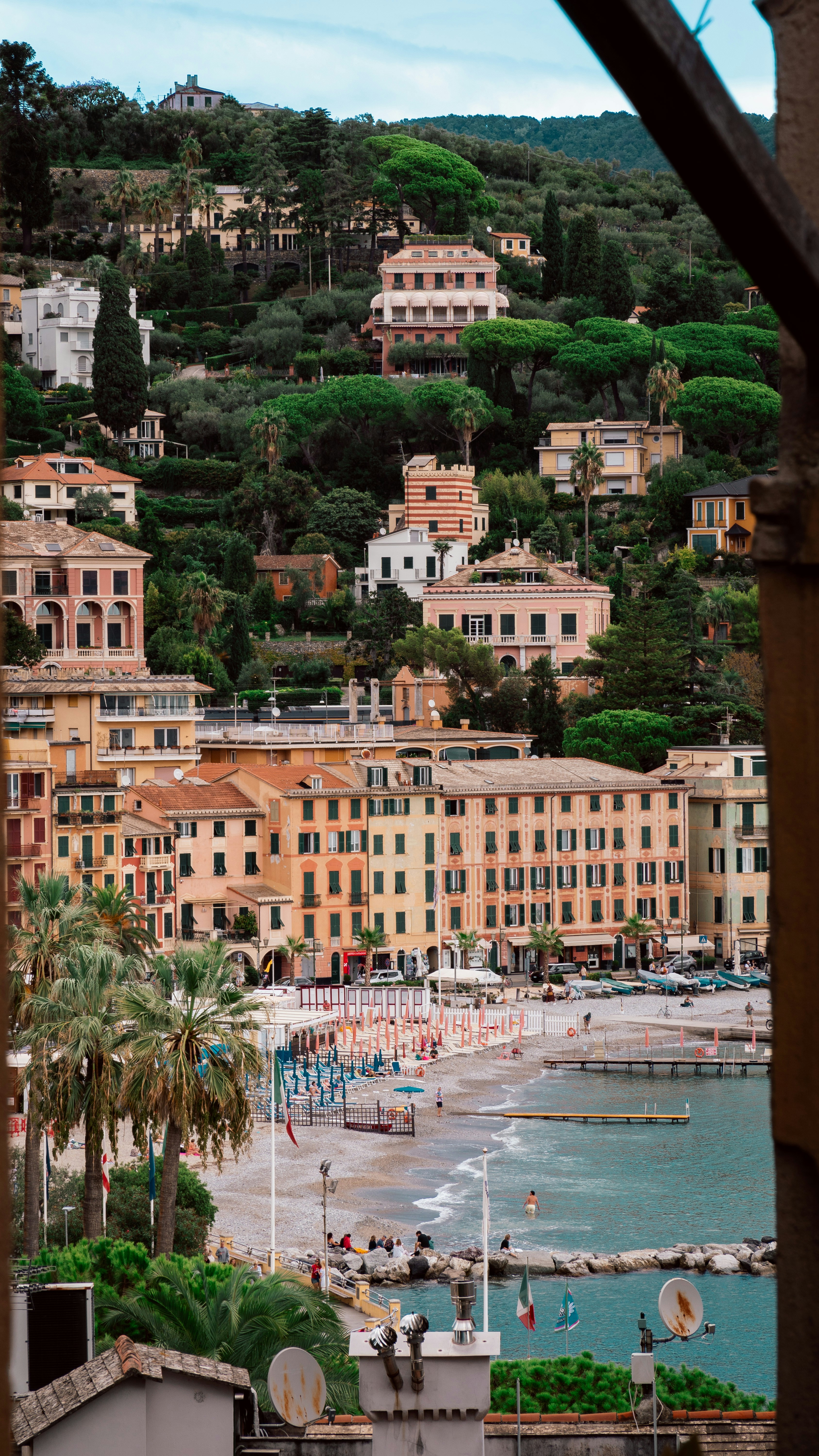 A view of a beach from a window in a building