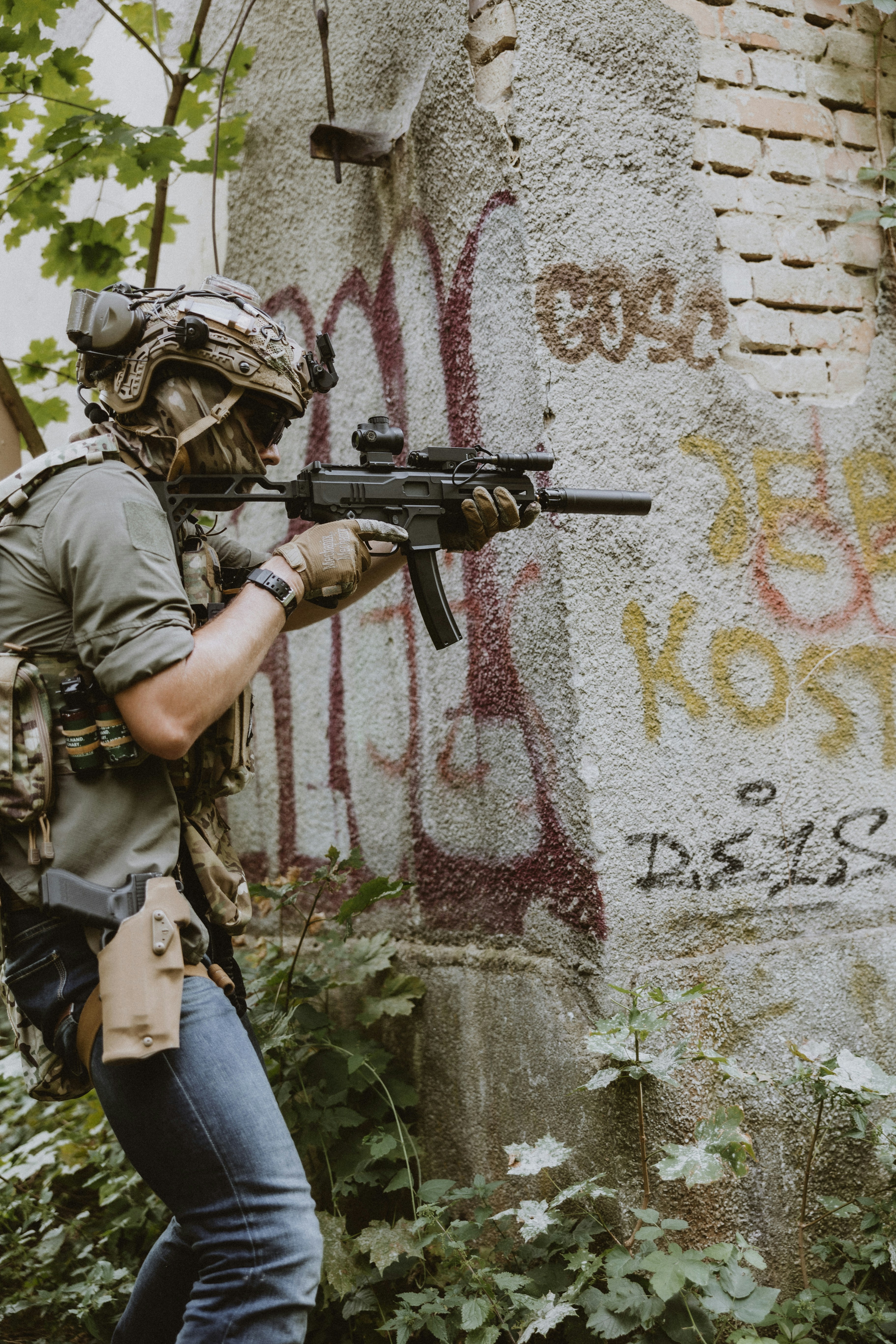 Airsoft player during the game using his new Double Eagle M924 DMP9 airsoft replica