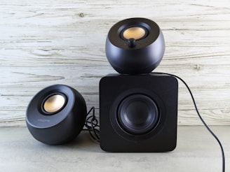 A pair of speakers sitting on top of each other