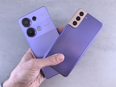 A person holding a purple phone in their hand