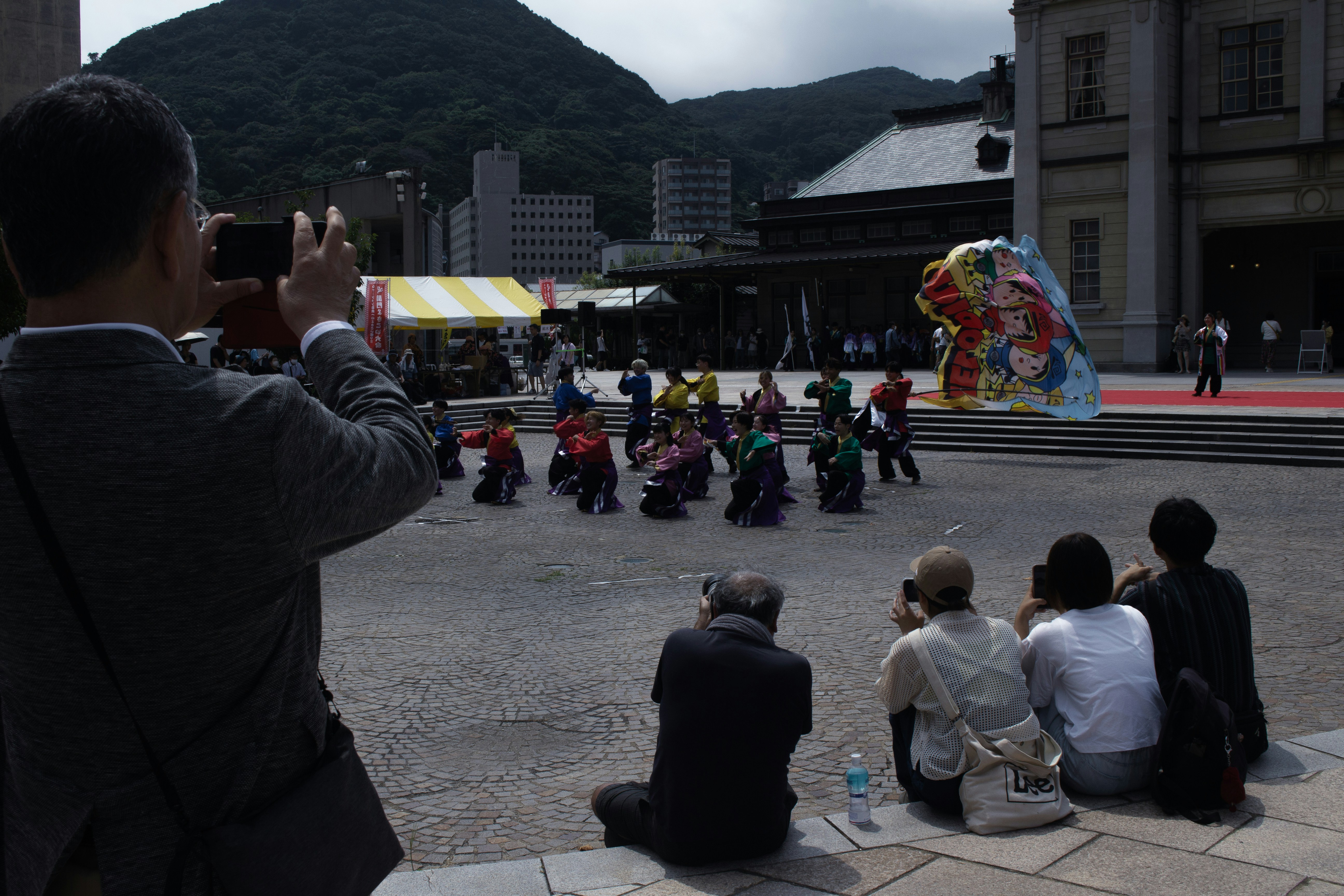 A man taking a picture of a group of people