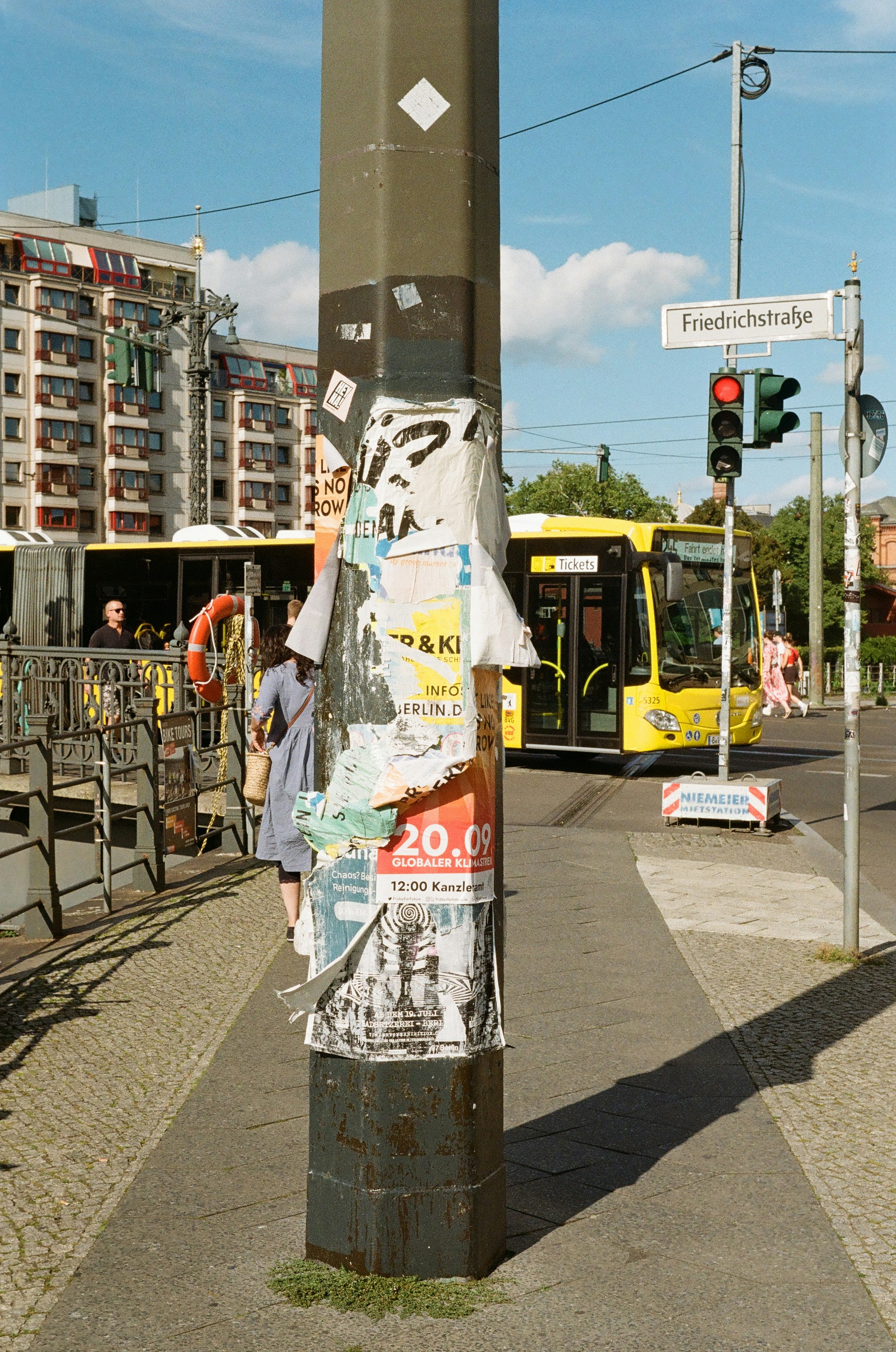 A pole that has a bunch of papers on it