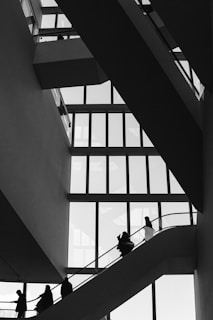 A group of people walking up and down a staircase