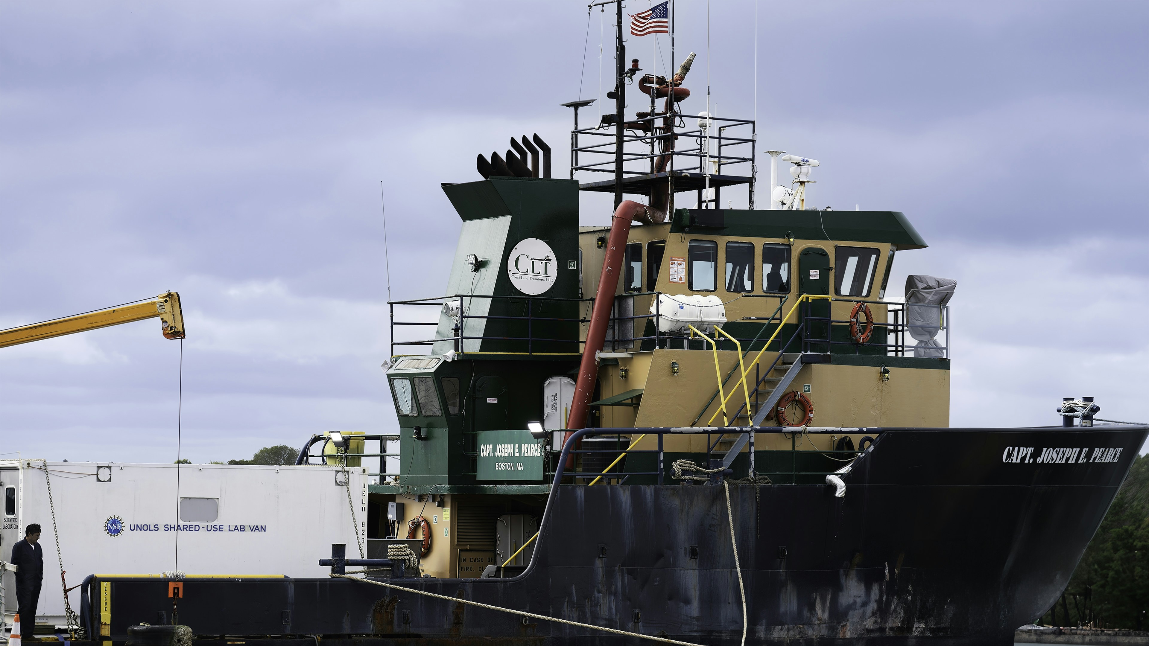 A large boat is docked in the water
