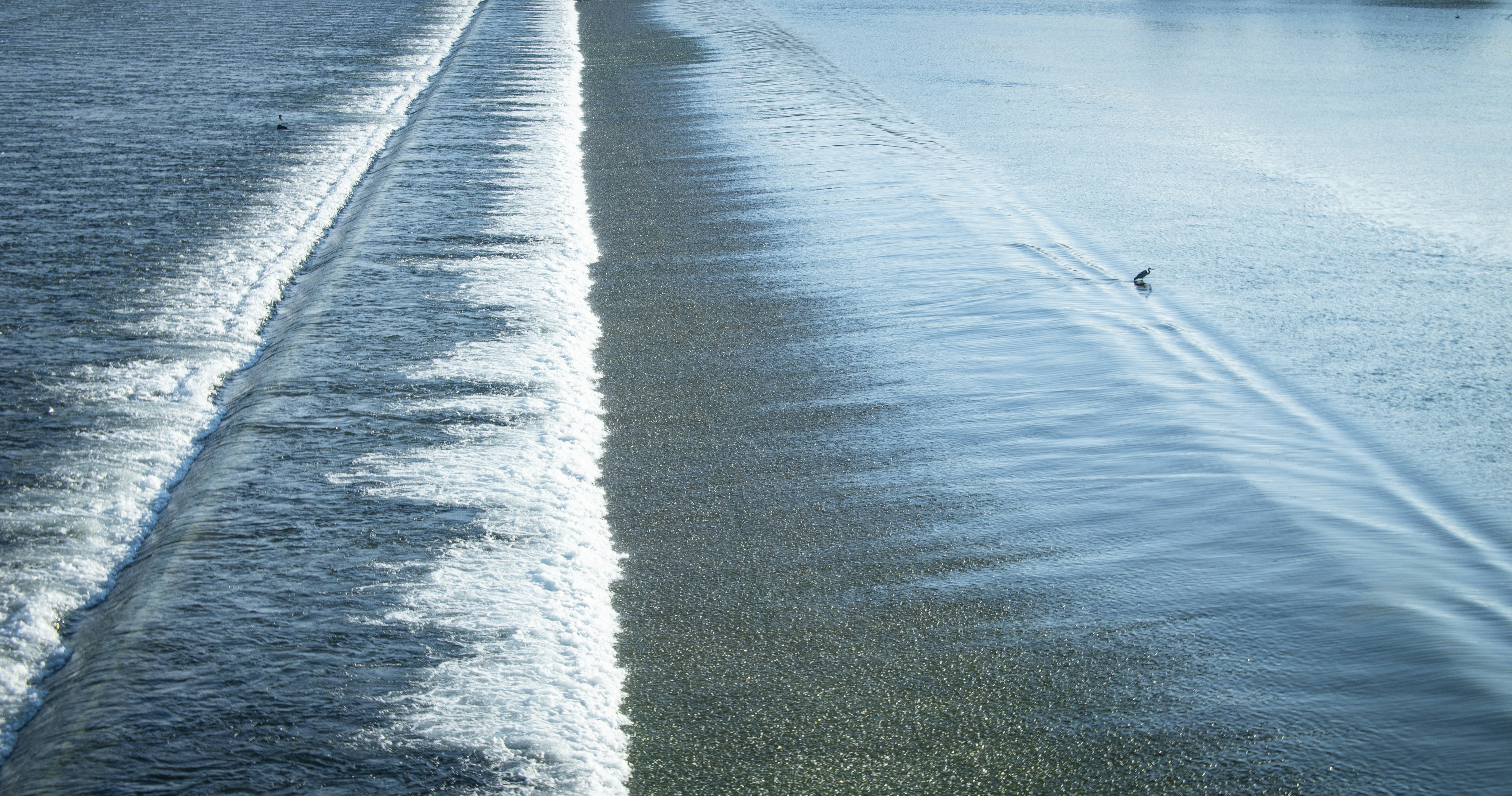 A couple of boats that are sitting in the water