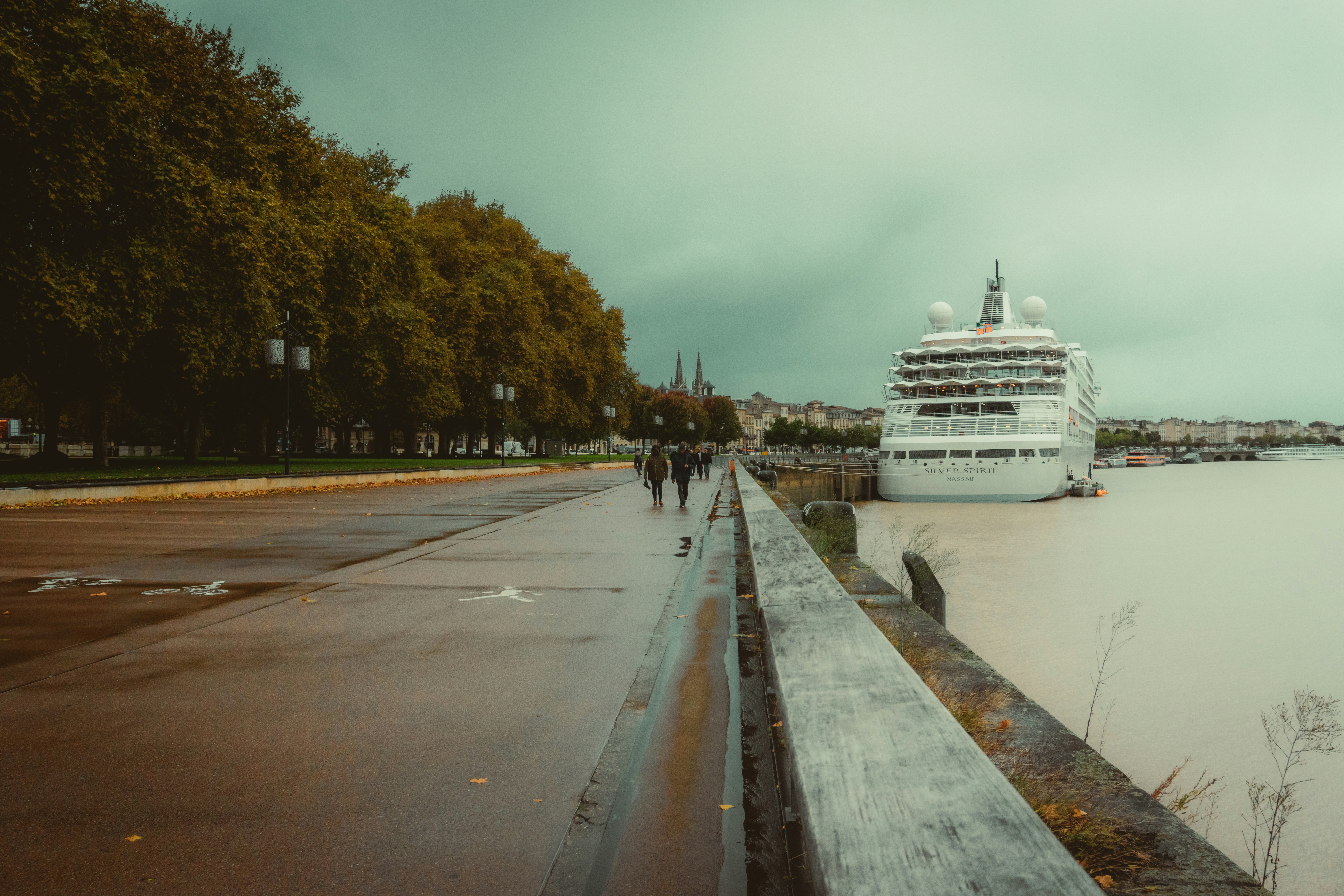 A cruise ship is docked at a dock