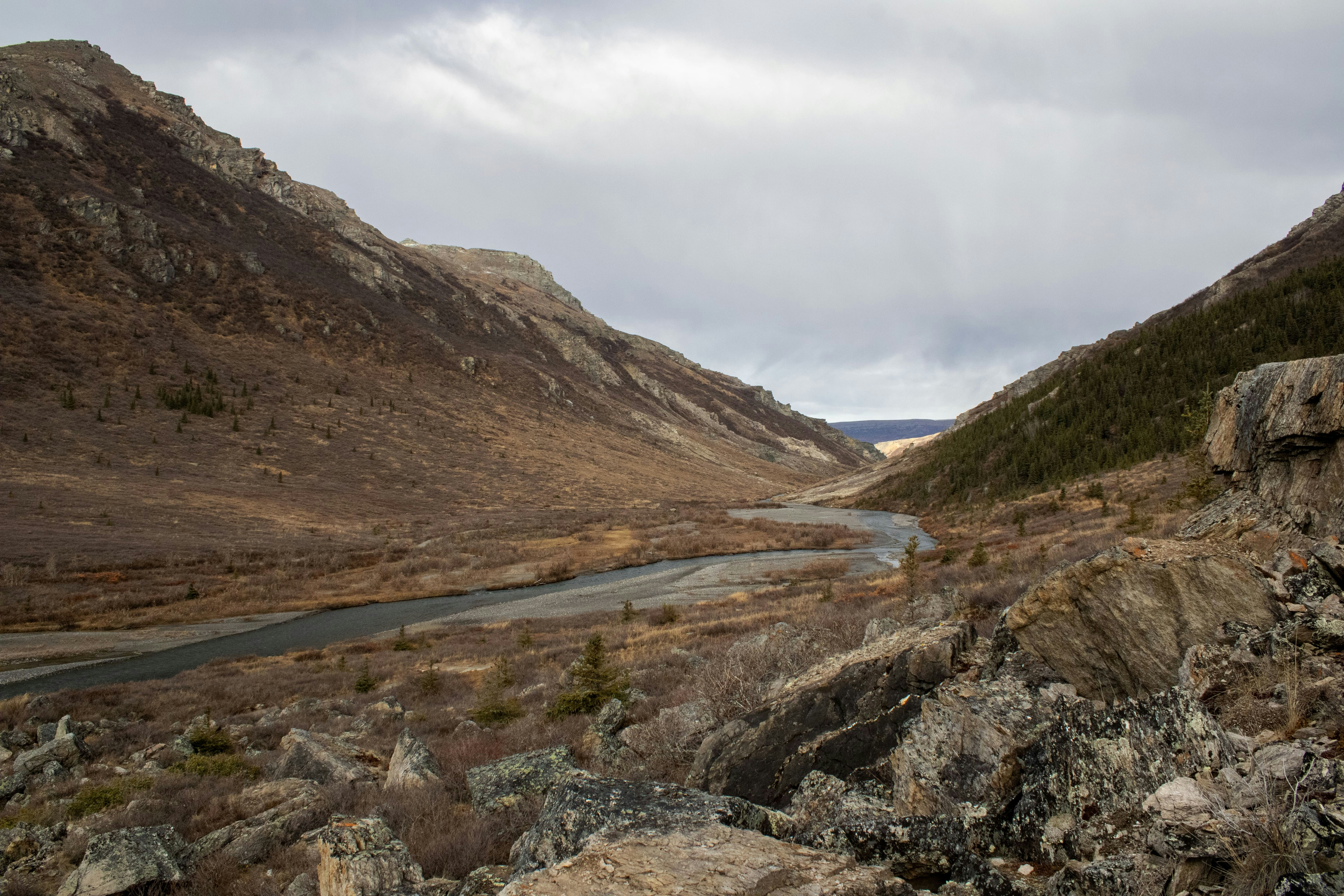 A winding road in the middle of a mountain range