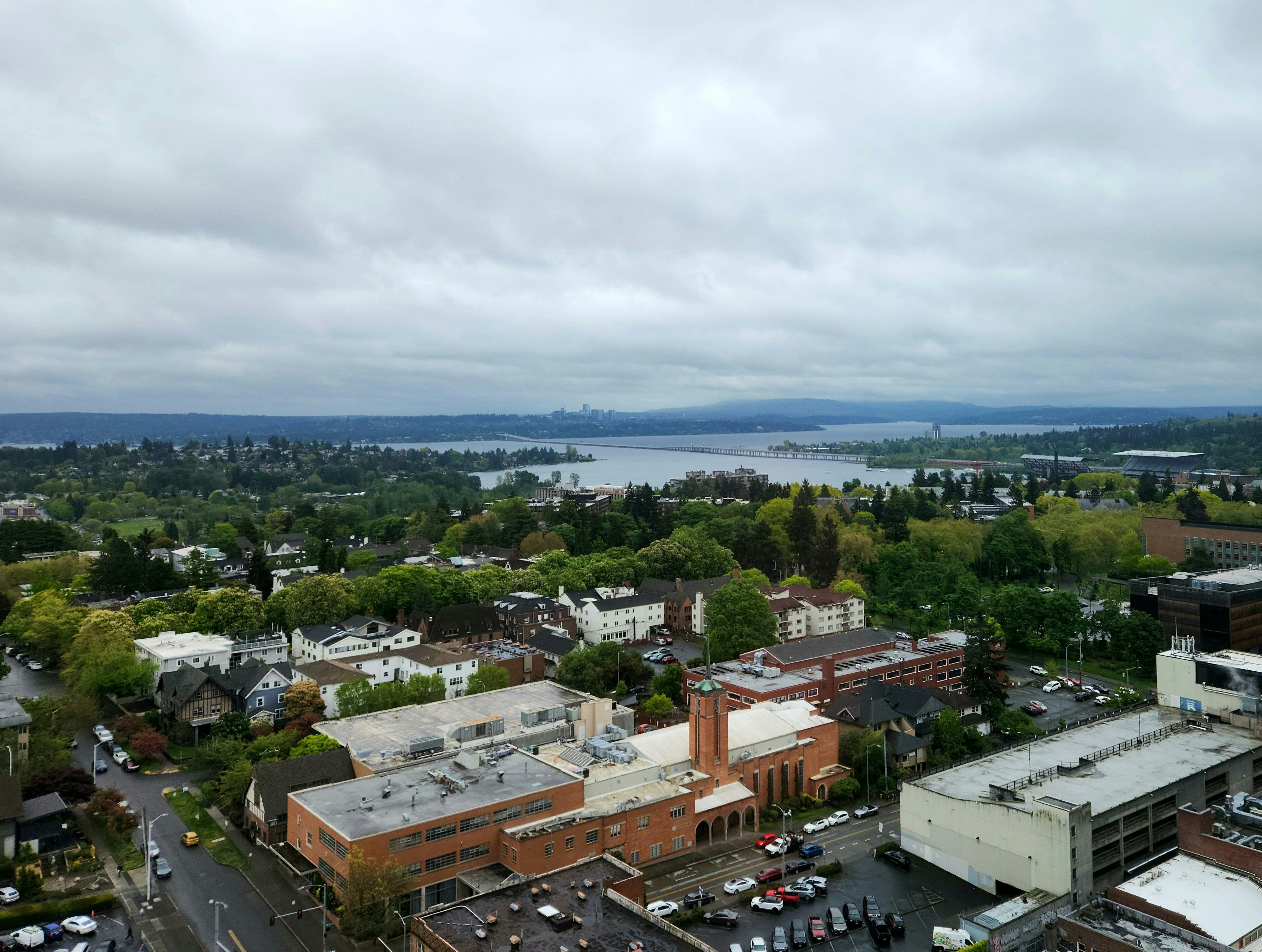 An aerial view of a city with a lake in the background