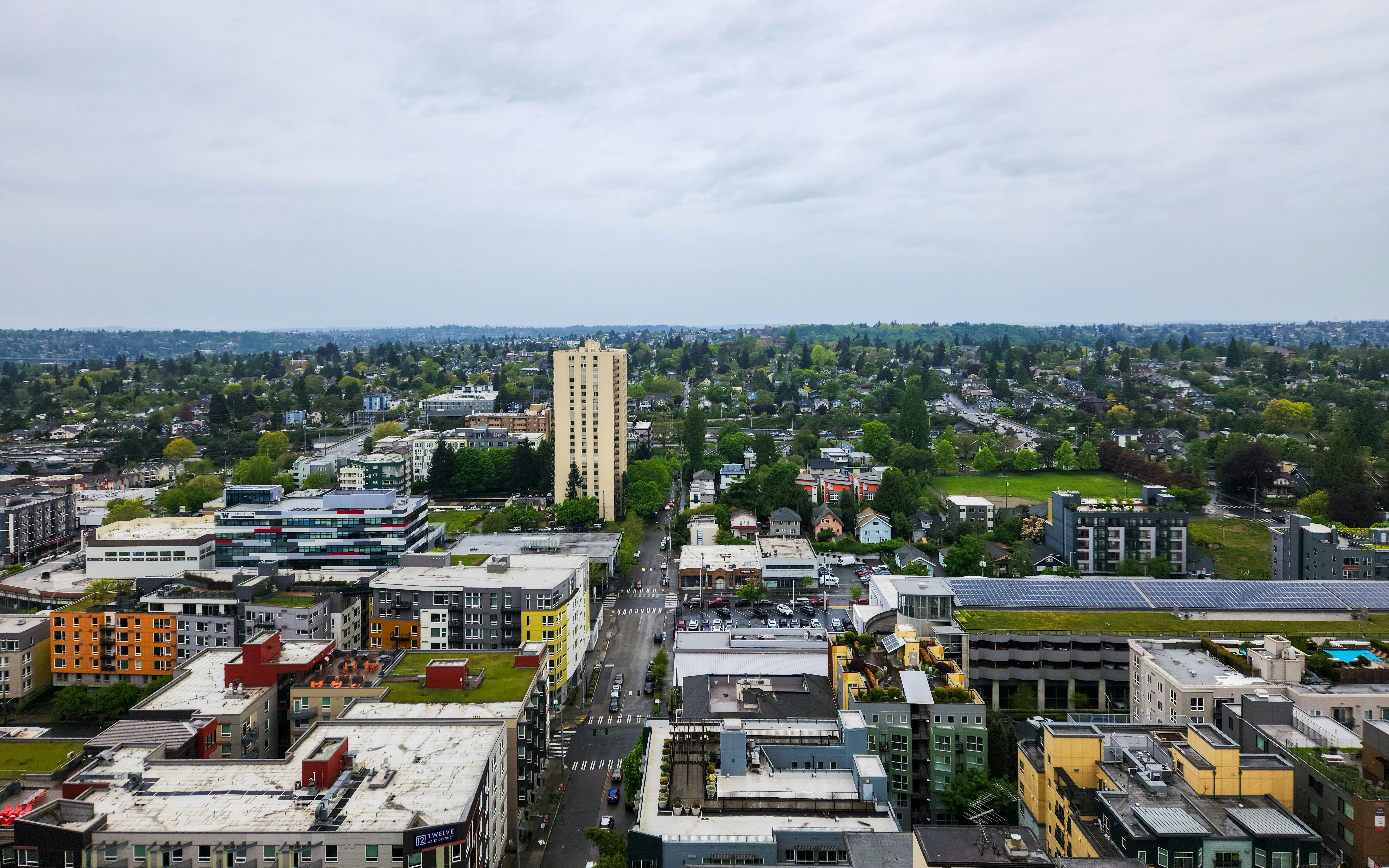 An aerial view of a city with tall buildings