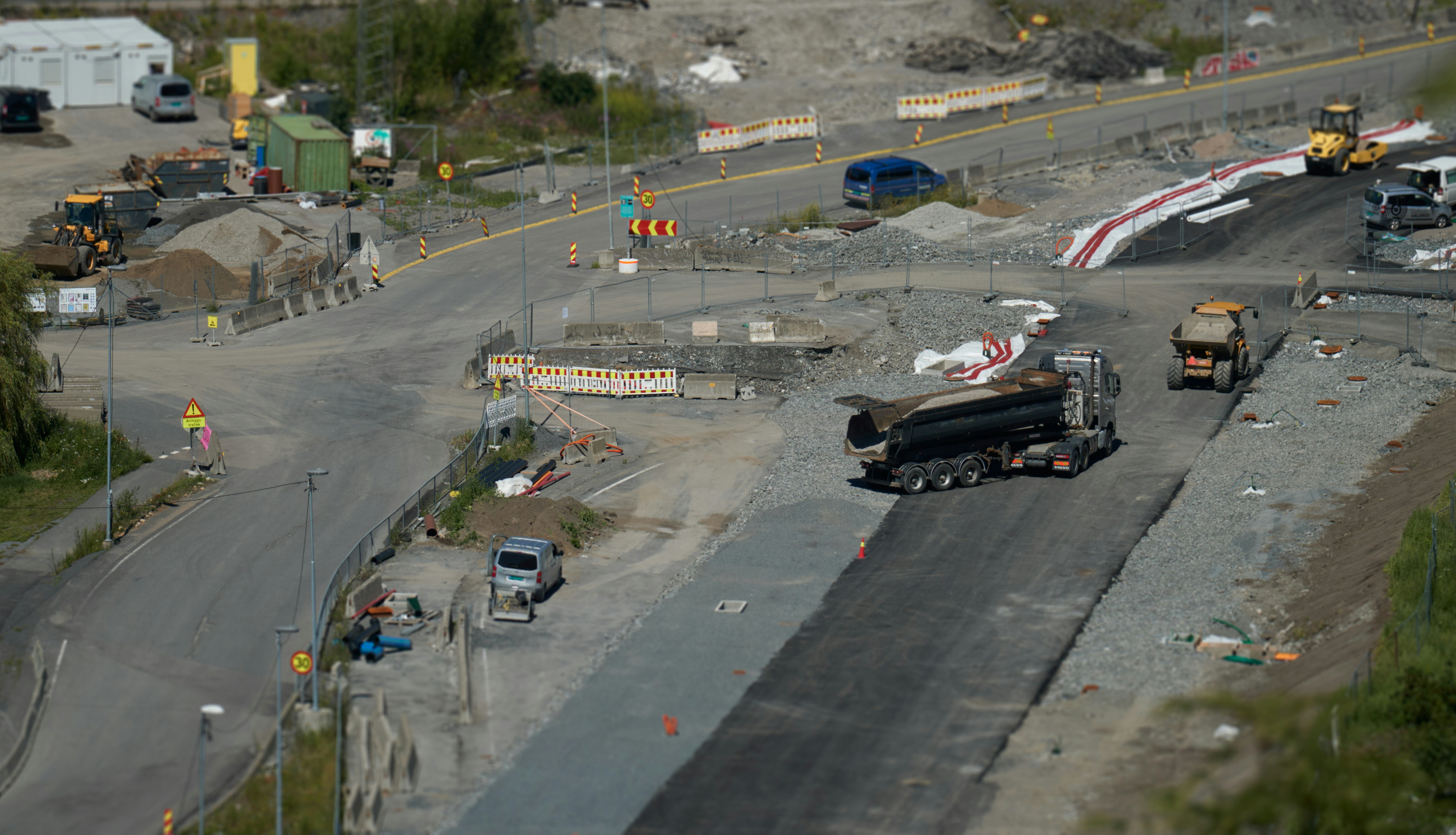 An aerial view of a construction site with trucks