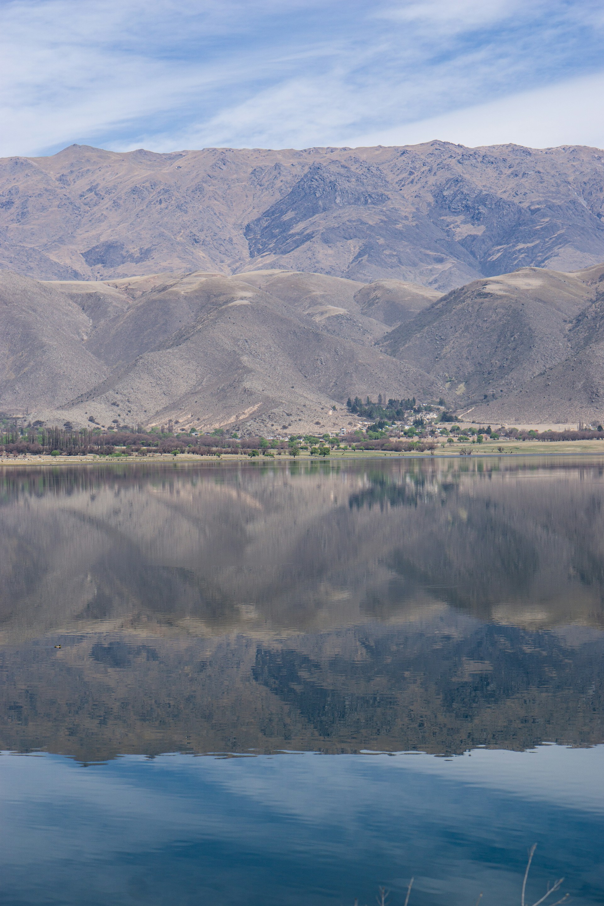 A large body of water surrounded by mountains