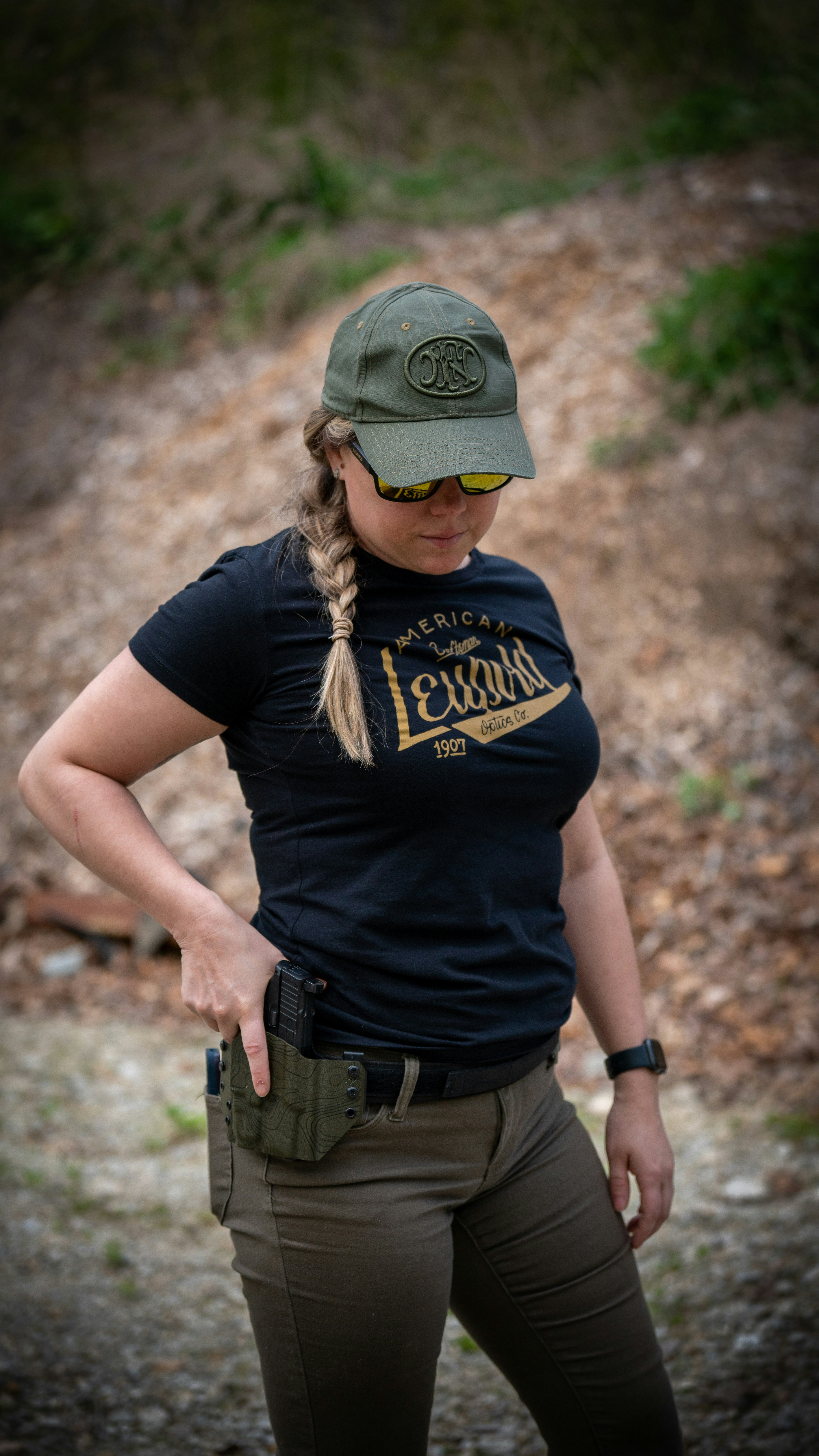 A woman wearing a hat and a black shirt