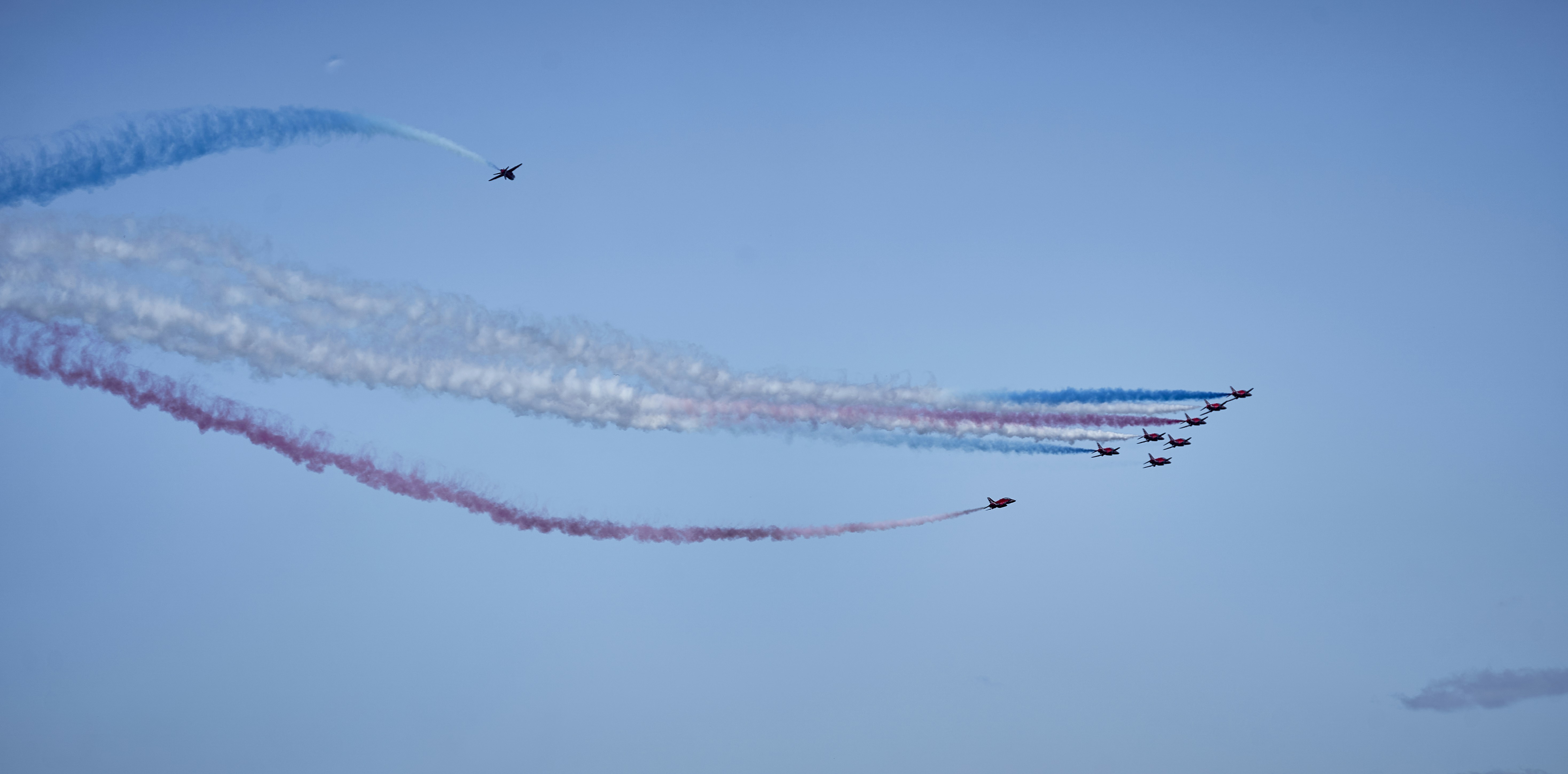 A group of people flying kites in the sky