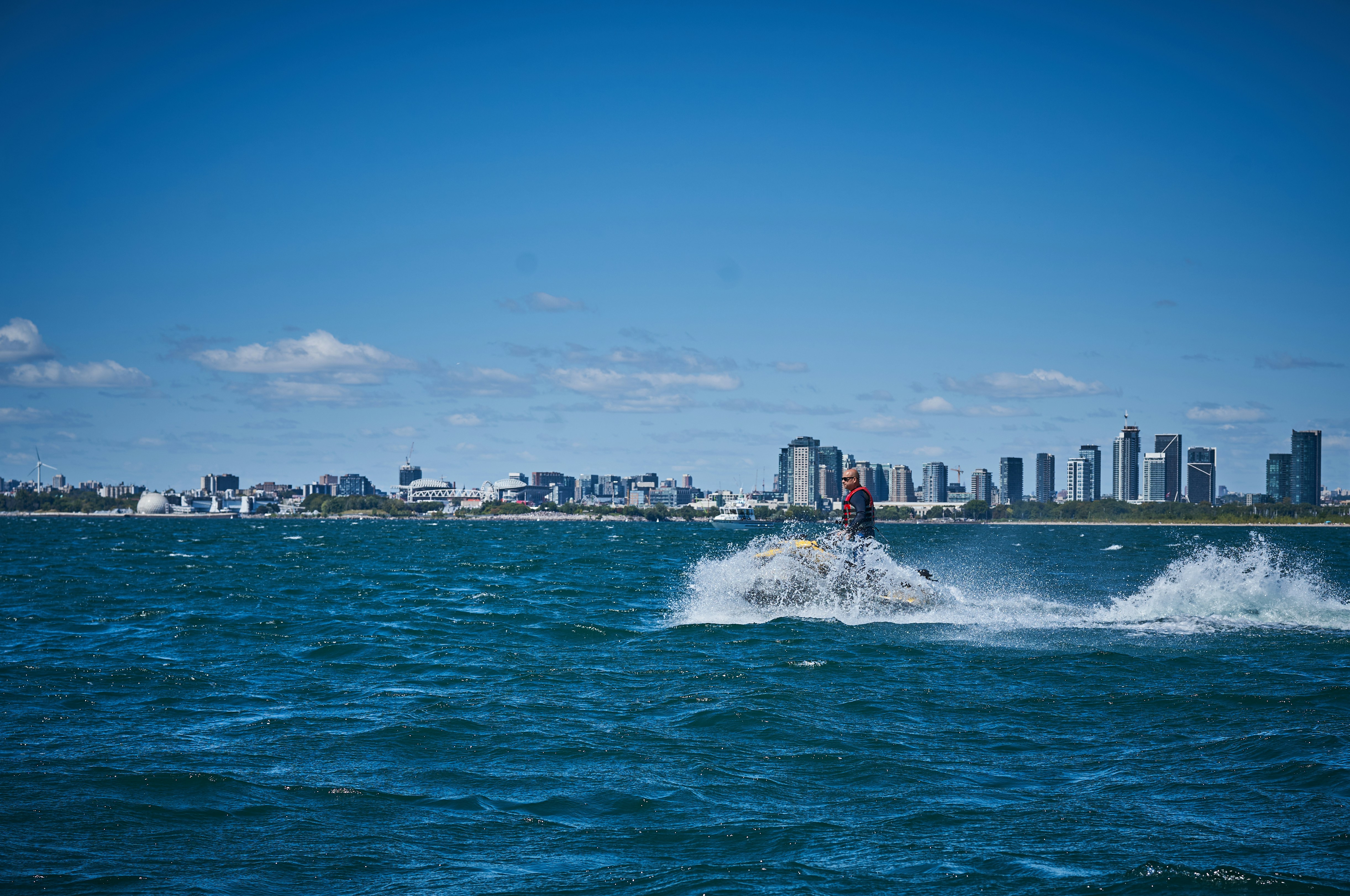 A person on a jet ski in the middle of the ocean
