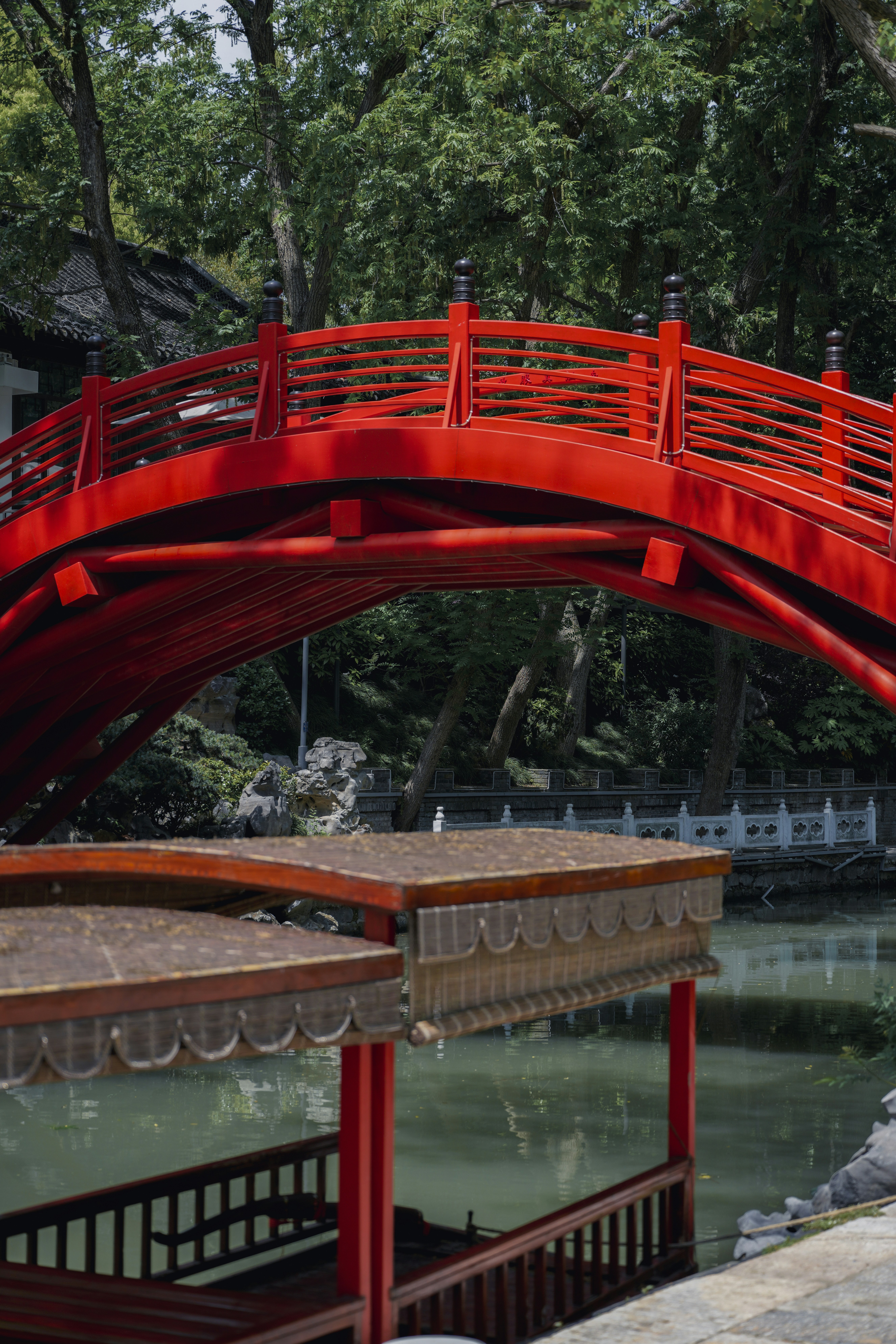 A red bridge over a body of water