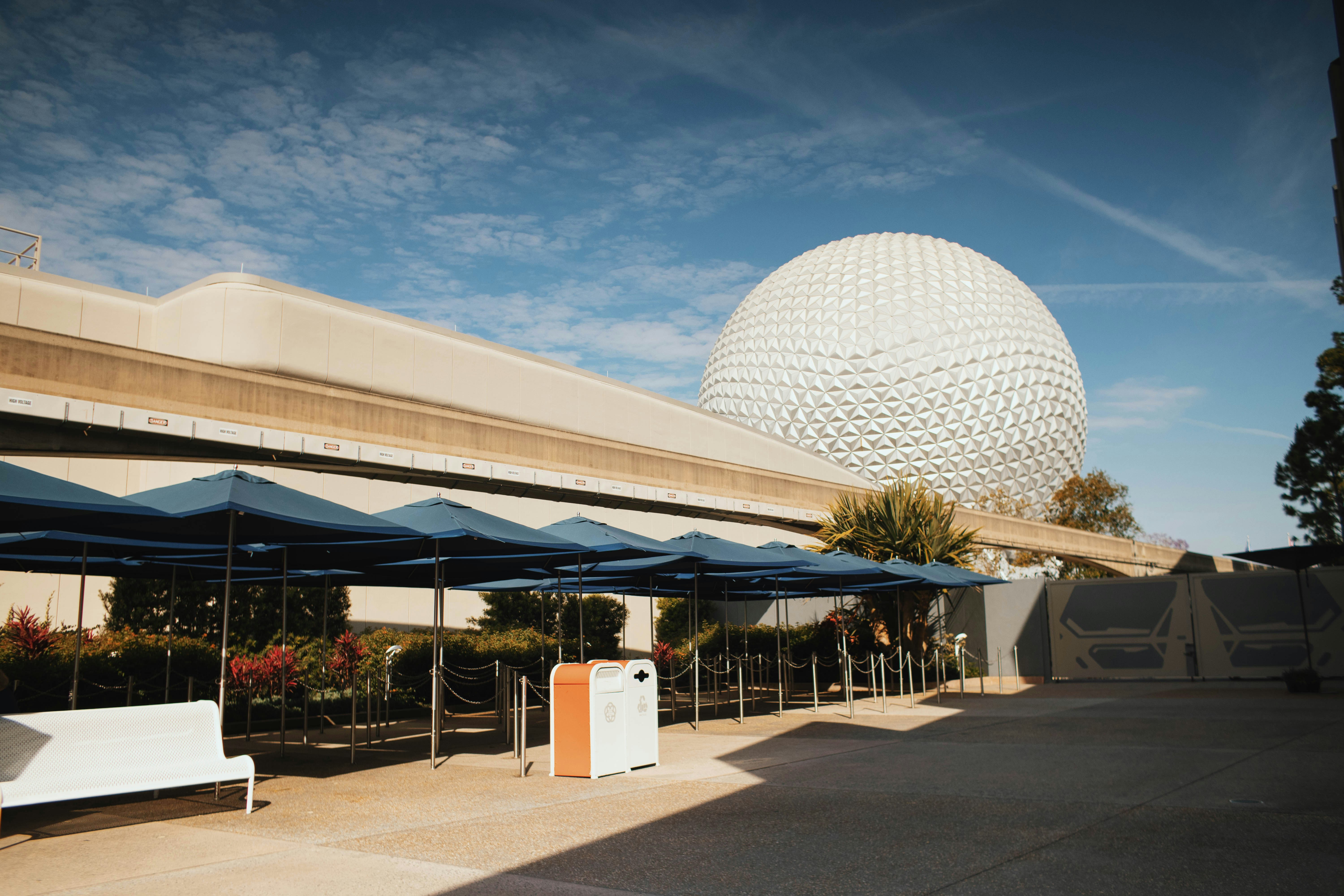 A building with a large white ball in the background