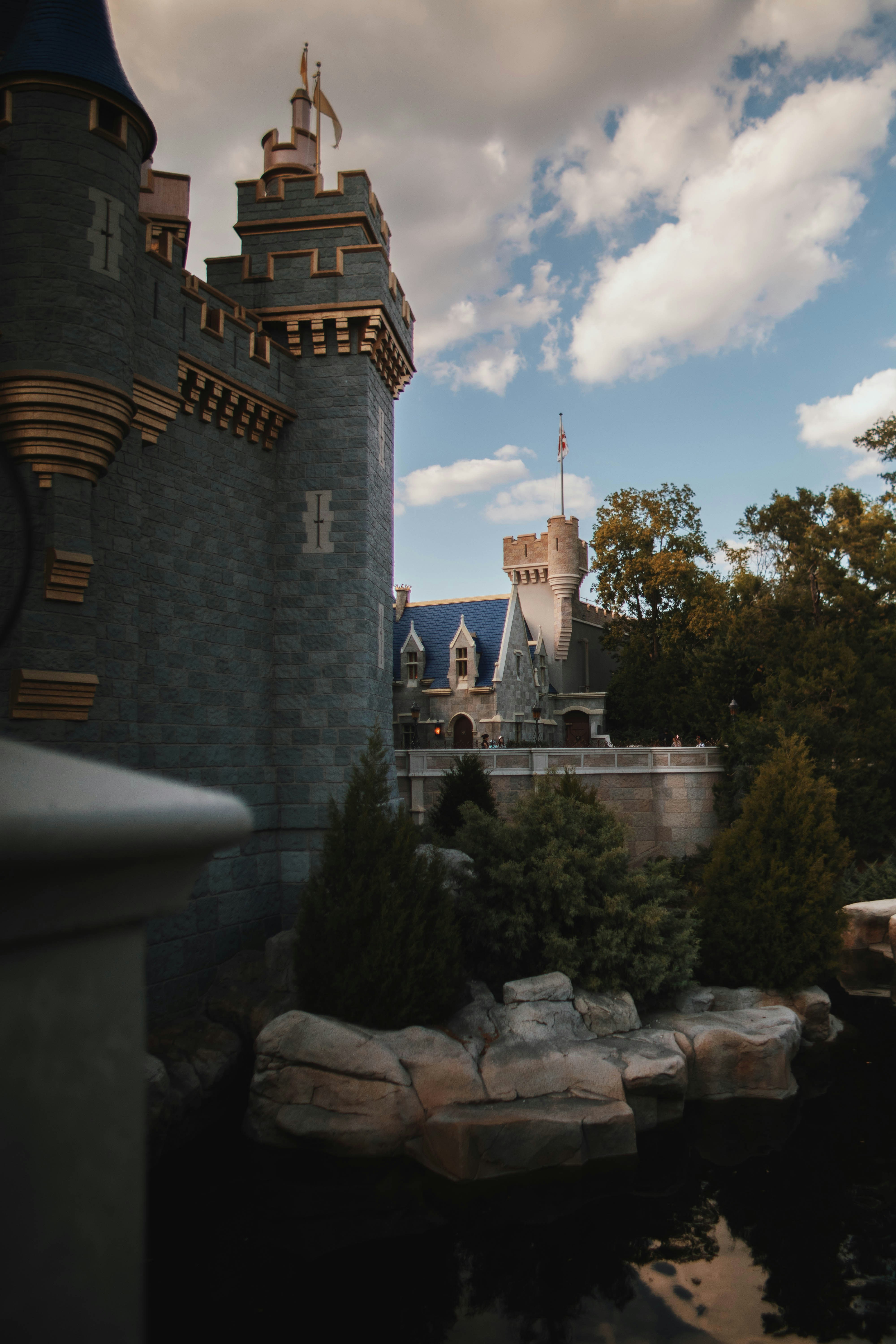 A view of a castle from across a pond