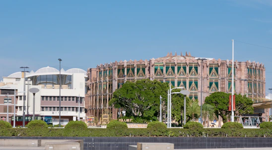 A large building sitting next to a body of water