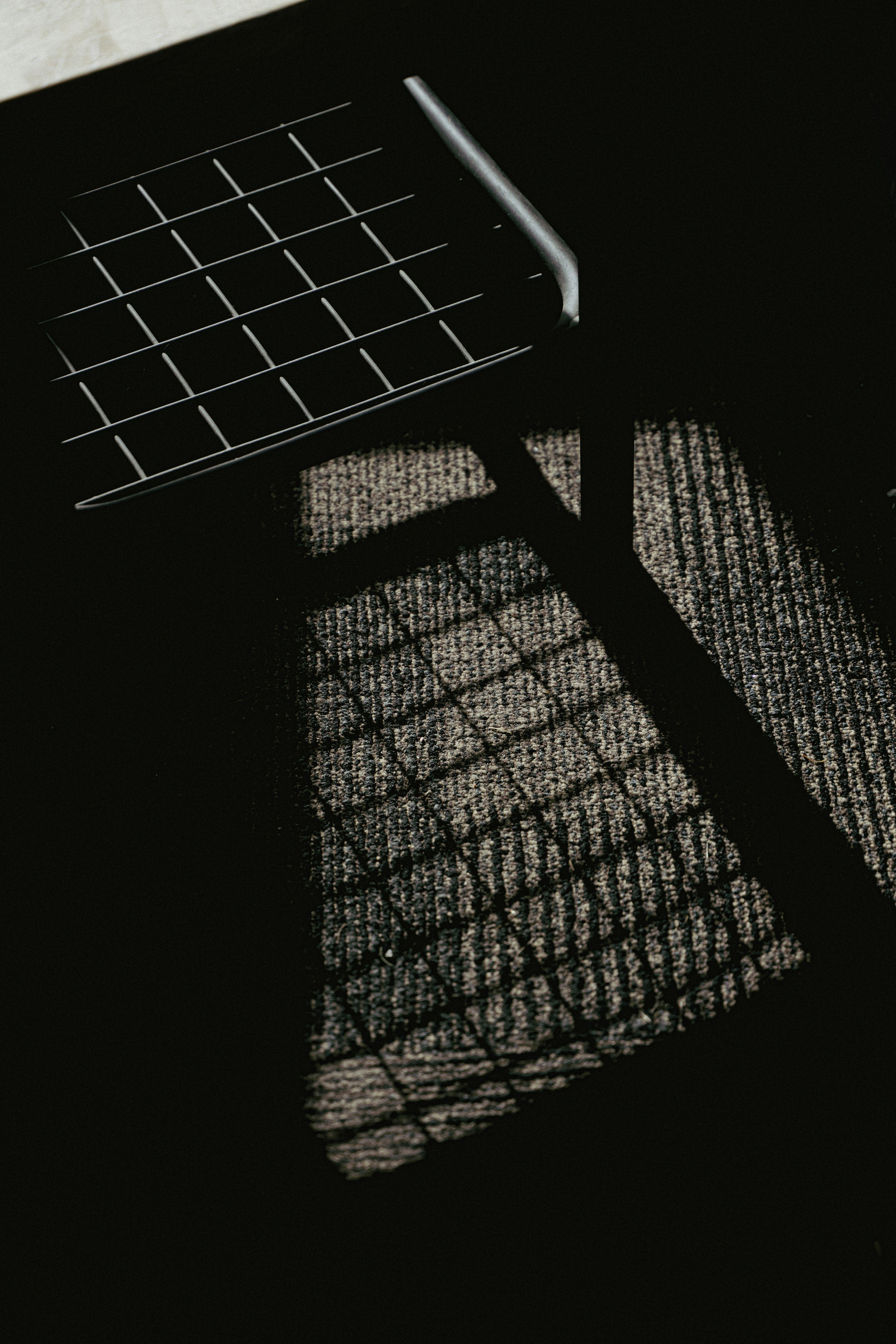 A chair sitting on top of a floor next to a window