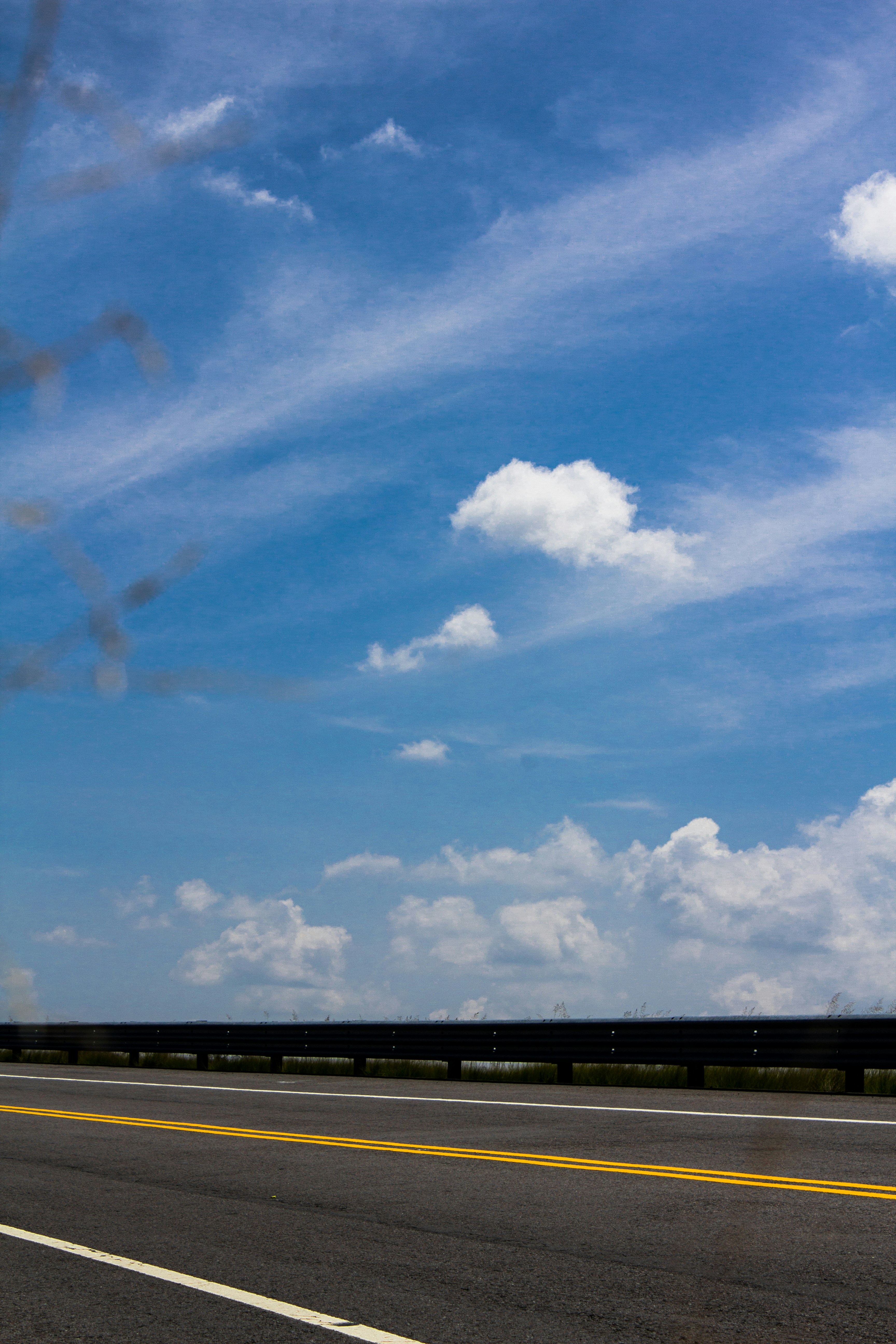 A red stop sign sitting on the side of a road