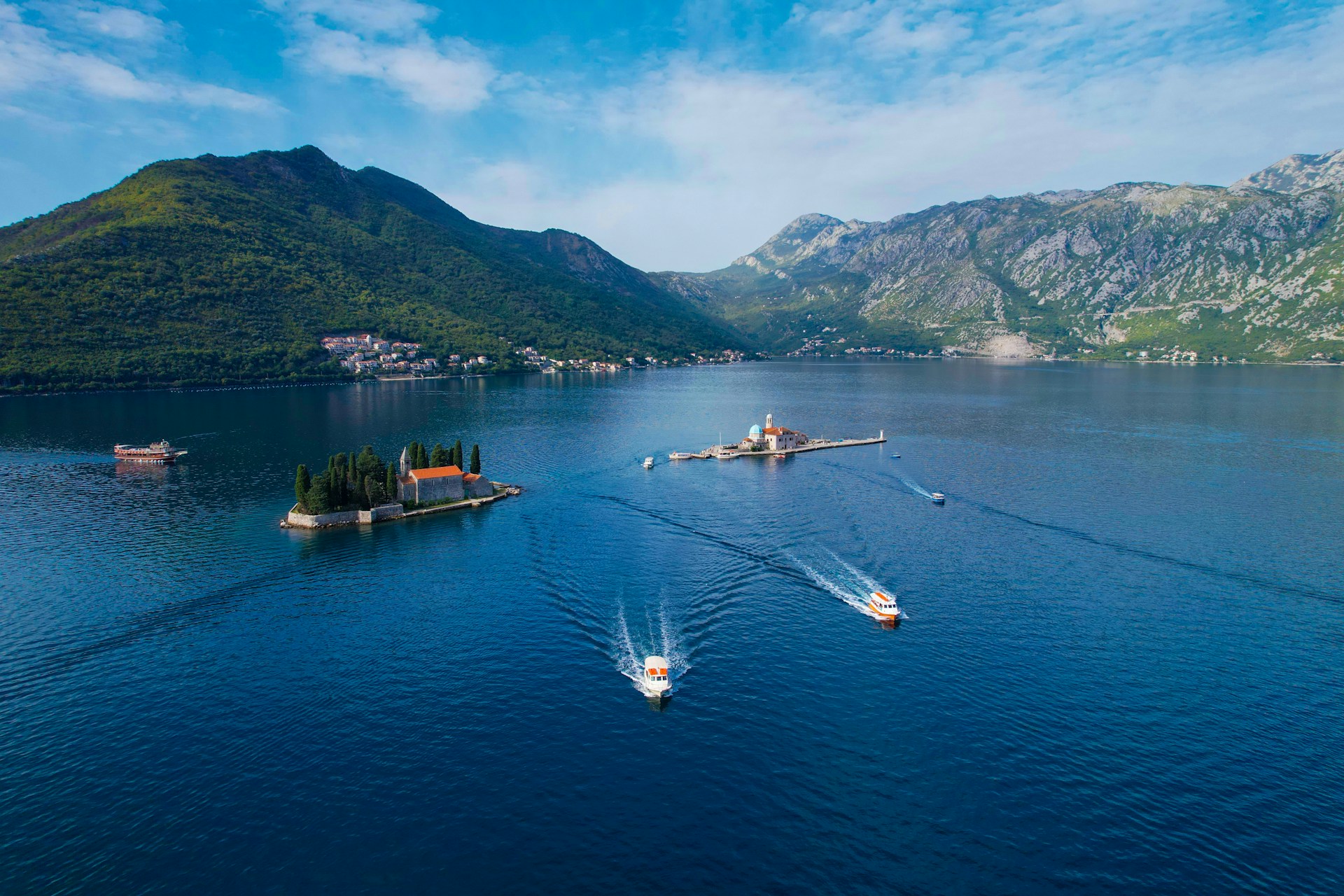 A large body of water surrounded by mountains