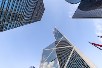 Looking up at a group of tall buildings