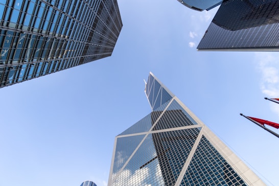 Looking up at a group of tall buildings