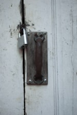 A door handle on a door with a lock on it