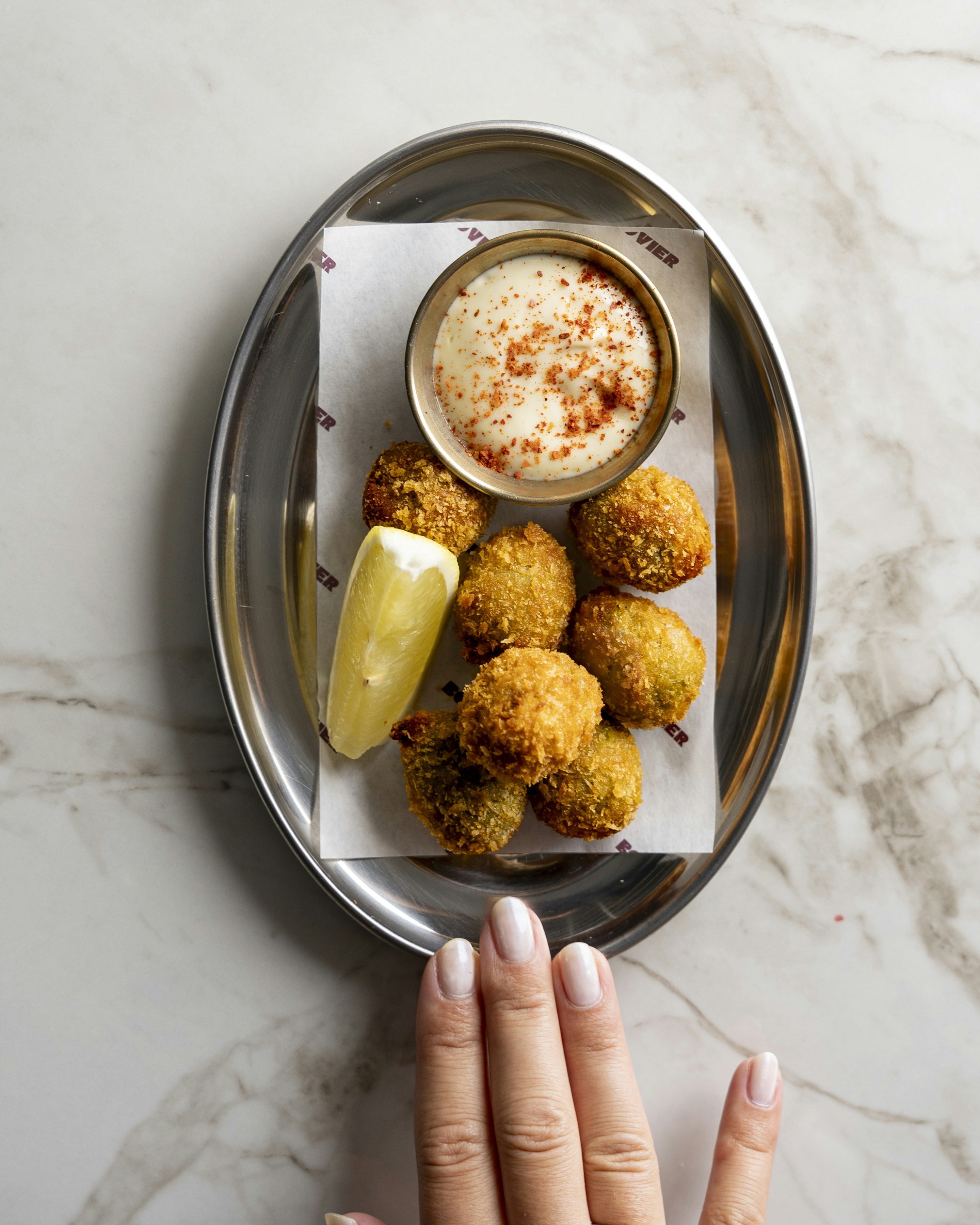 A plate of food on a marble table