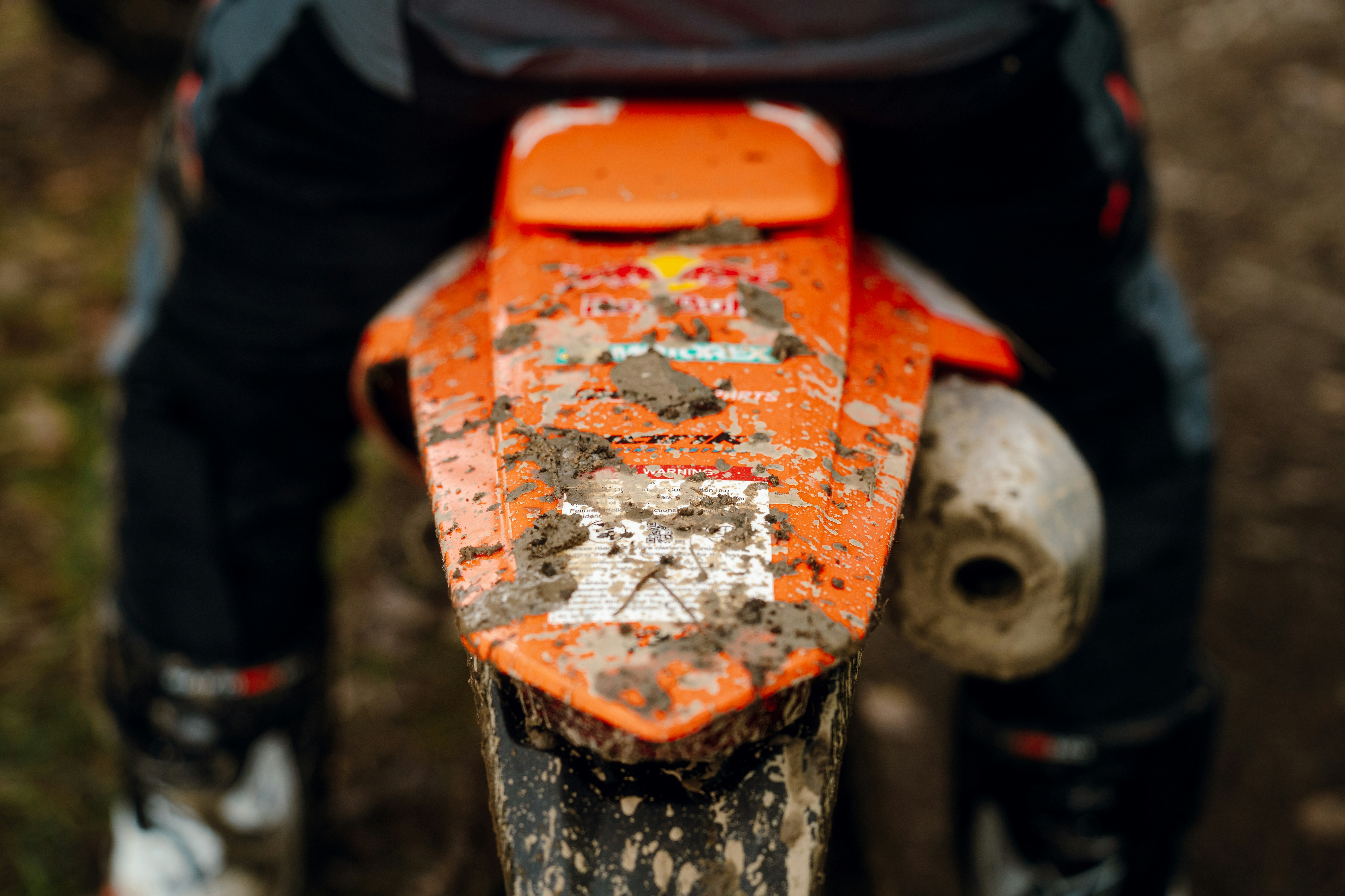A close up of a person riding a dirt bike