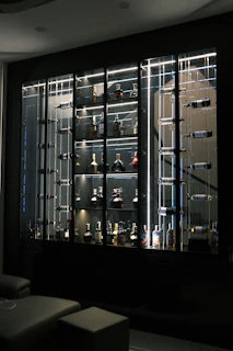 Glass wine room with clear glass walls and door in a new home