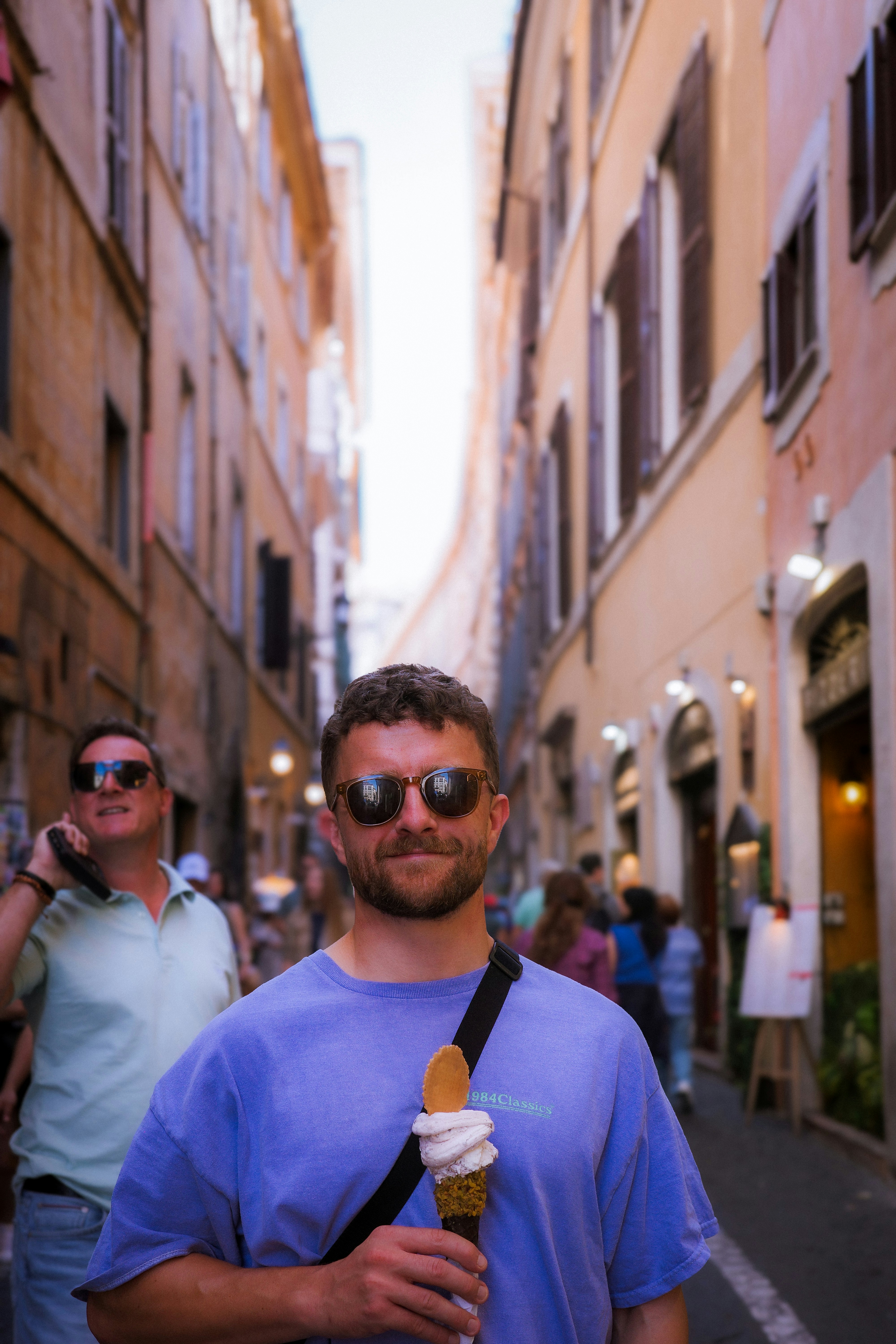 A man enjoying gelato in a Roman side street