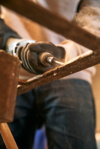A close up of a person working with wood