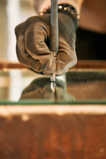 A person holding a piece of metal in their hand