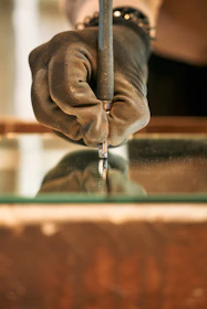 A person holding a piece of metal in their hand