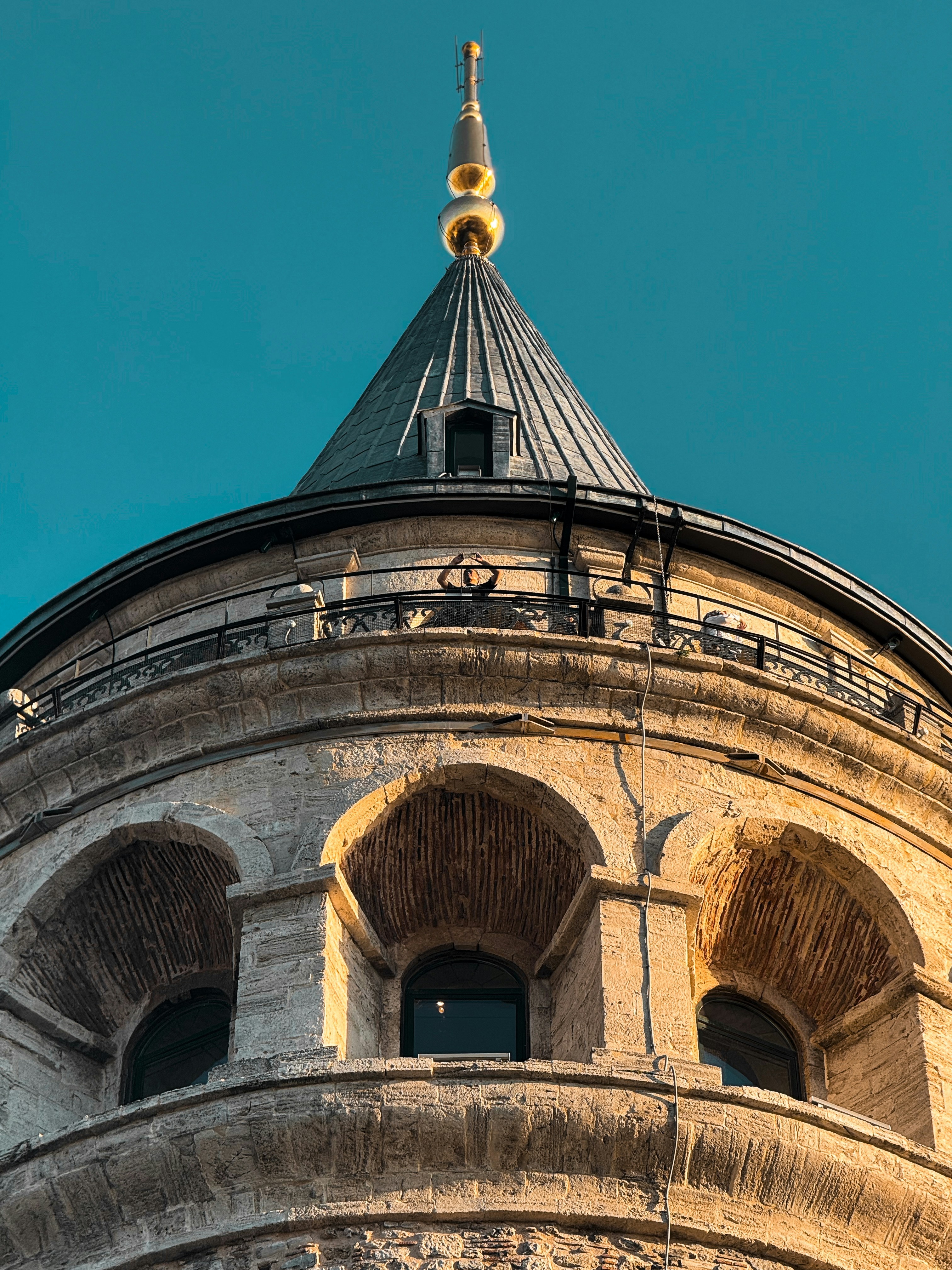 The top of a building with a clock on it