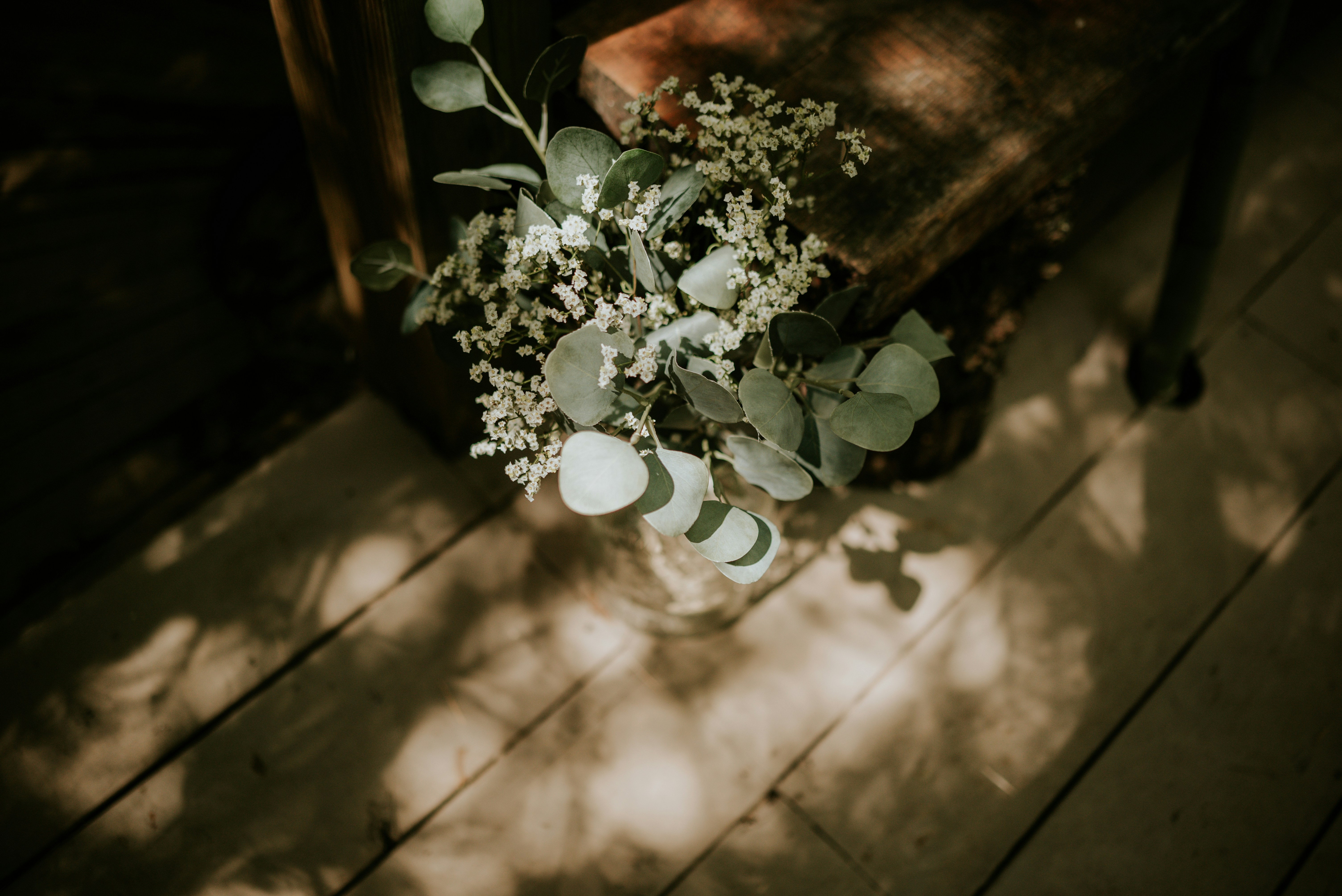 A bouquet of flowers sitting on top of a wooden table photo Free