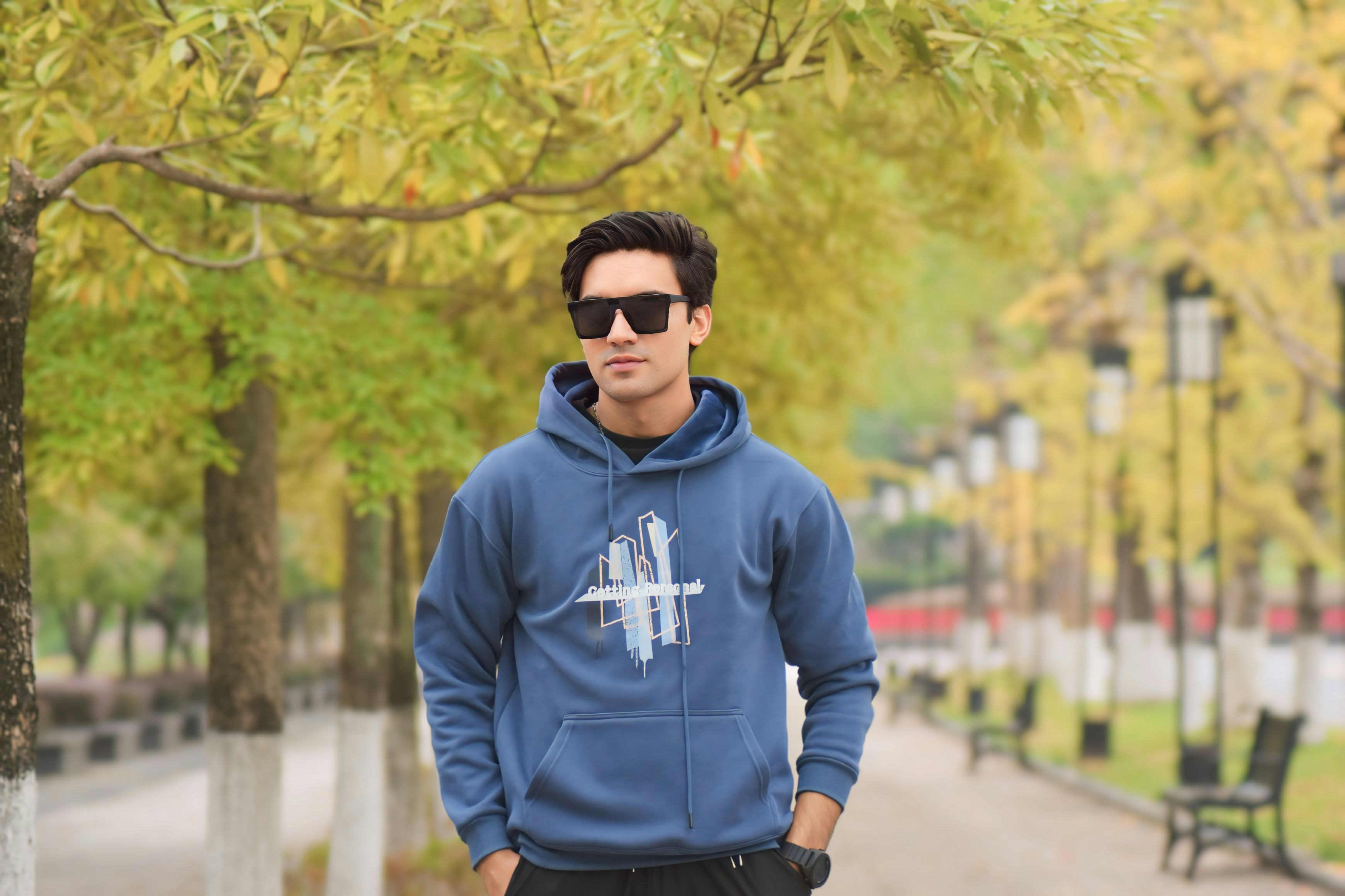 Model boy standing in autumn road. Autumn