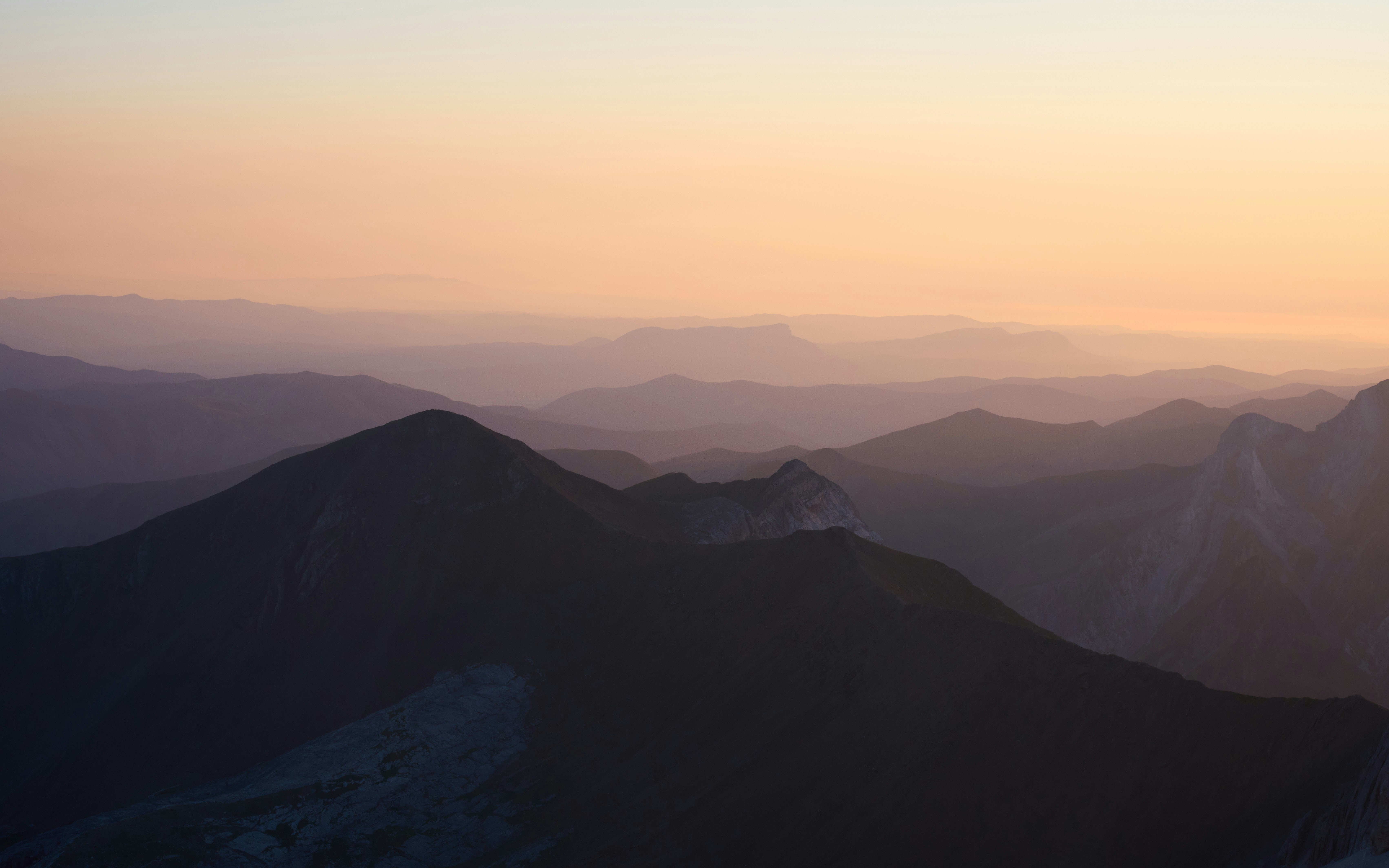 A view of a mountain range at sunset