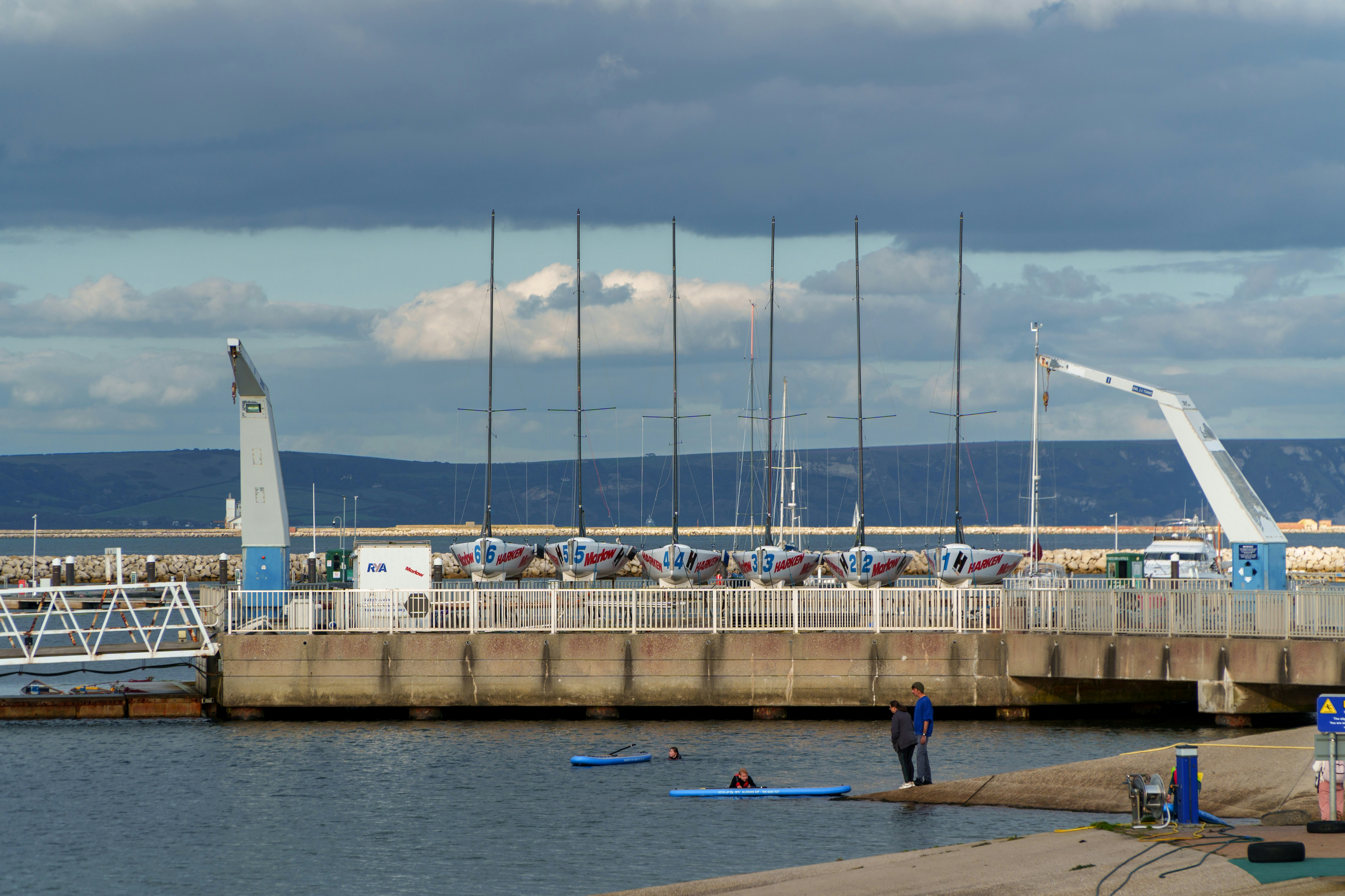 Lead instructor standing confidently by the water
