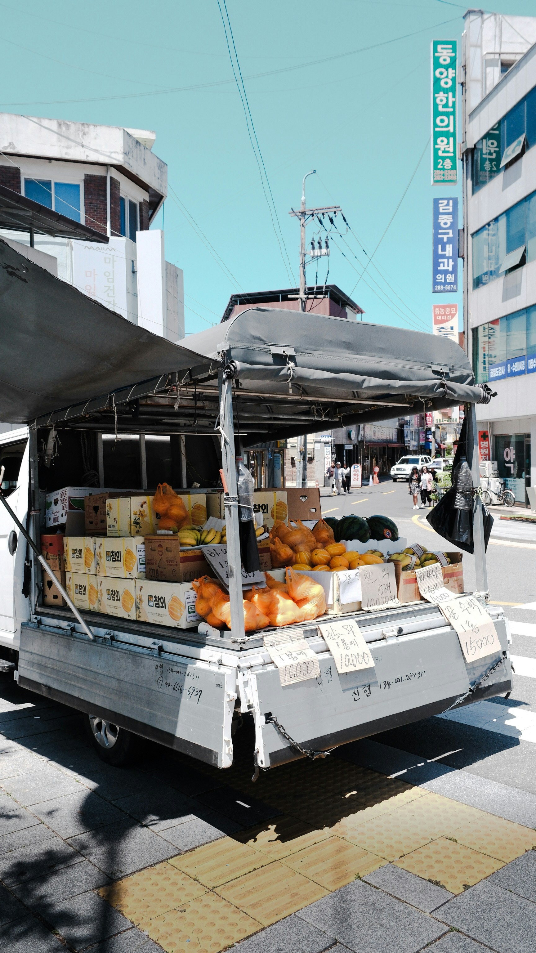A food truck is parked on the side of the road
