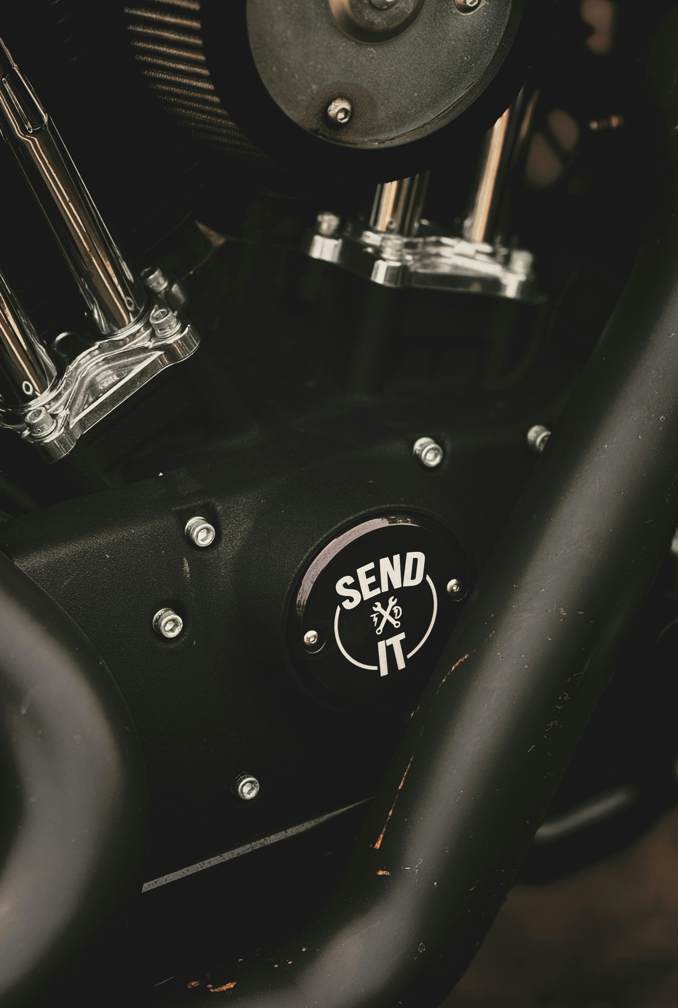 A close up of a black motorcycle engine