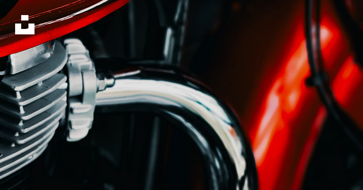 Royal Enfield Script A red motorcycle with a royal enfield sticker on it photo – Free Red ...