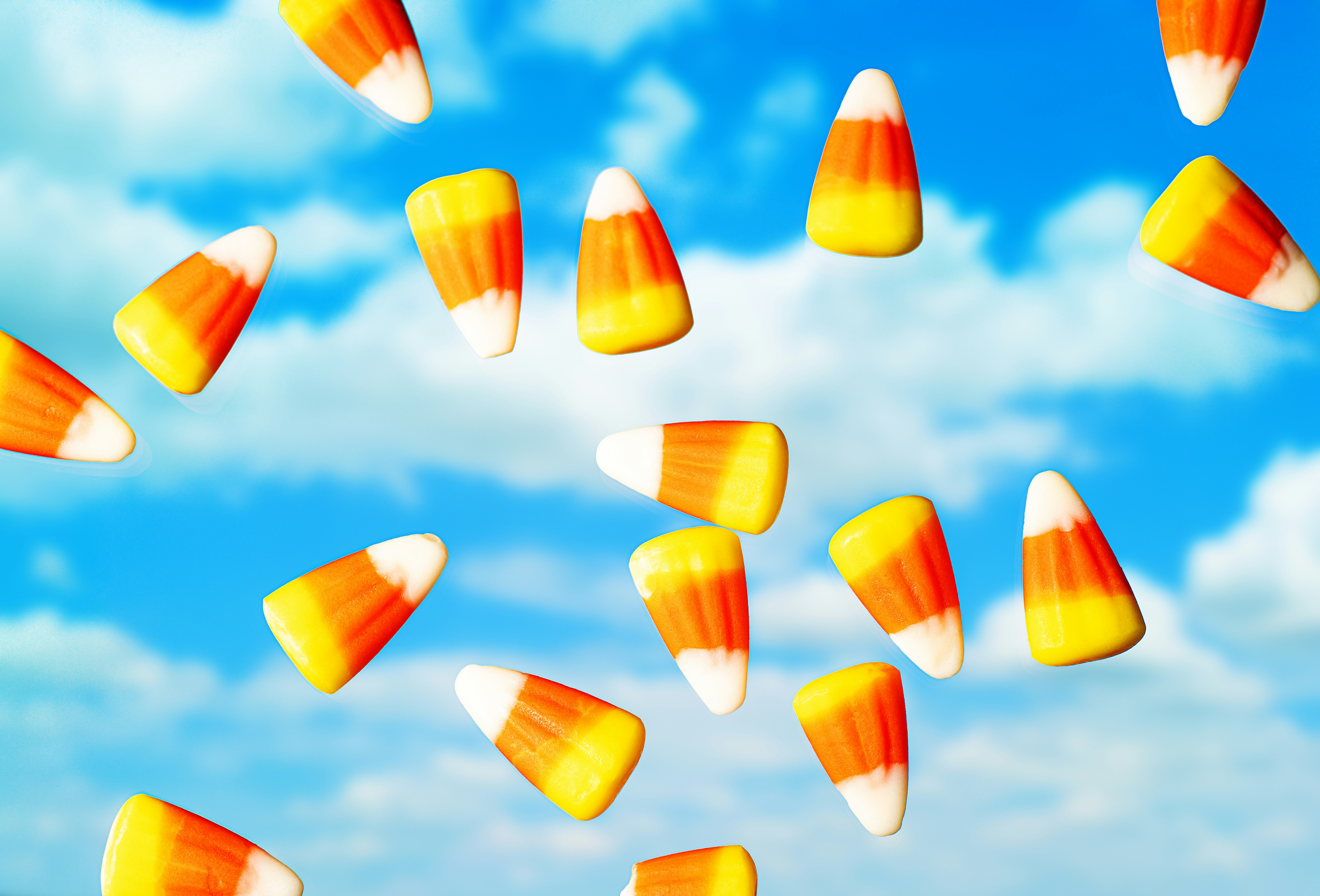 A group of candy corn falling into the air